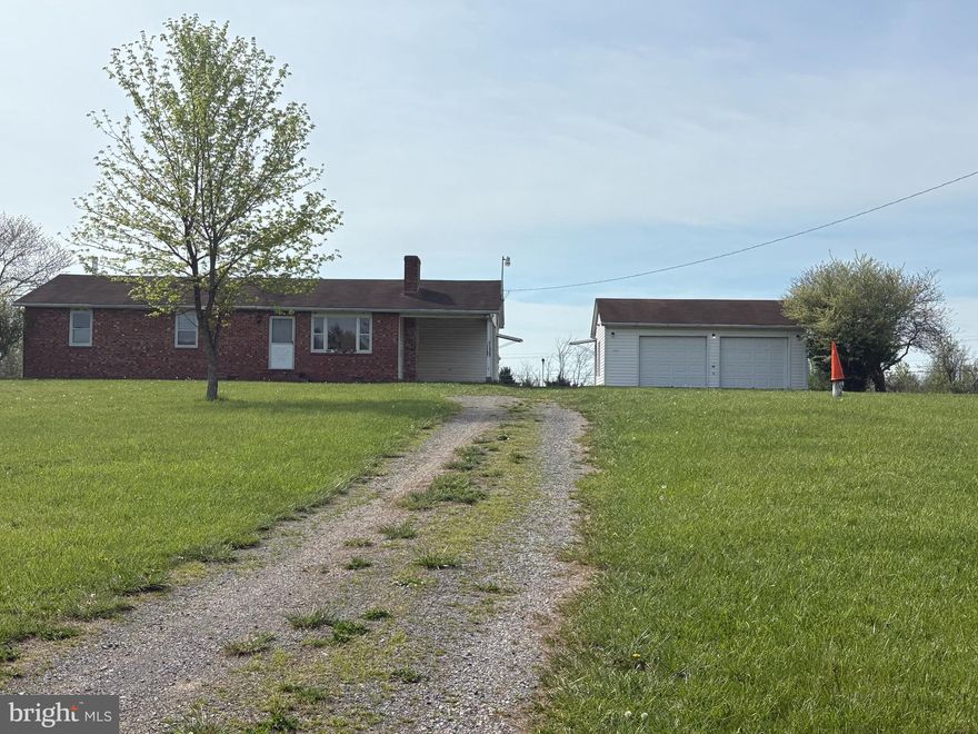 This 5 acres parcel of land is featuring a three spacious bedroom, two bath rambler with a detached oversized two car garage  * * * Living room wood burning fireplace  has a brick hearth * * *  There is a laundry room feature off the breakfast room, kitchen area which offers exterior door direct in line to the garage * * * This property is looking for a little finishing TLC to make "HOME"  * * * All the construction supplies in the main house convey with the purchase * * * The items in the garage, and under the carport do not convey with the real estate sale * * * The property rounds out the the end of Leslie Lane which has a few cluster of homes  * * * This is a property waiting for your personalize renovation to call "HOME" on 5 acres!!