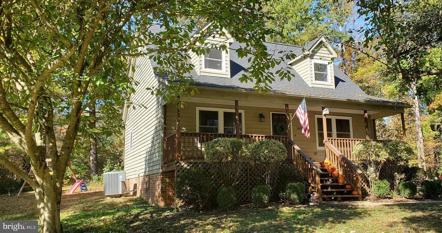 Sit back, relax and enjoy nature on the front porch of this lovely Cape Cod.  This beautiful home features a first floor primary bedroom and 2 spacious bedrooms upstairs.  Recently updated stainless steel appliances in the eat-in kitchen.   Oversized driveway for ample parking.  Don't miss out!