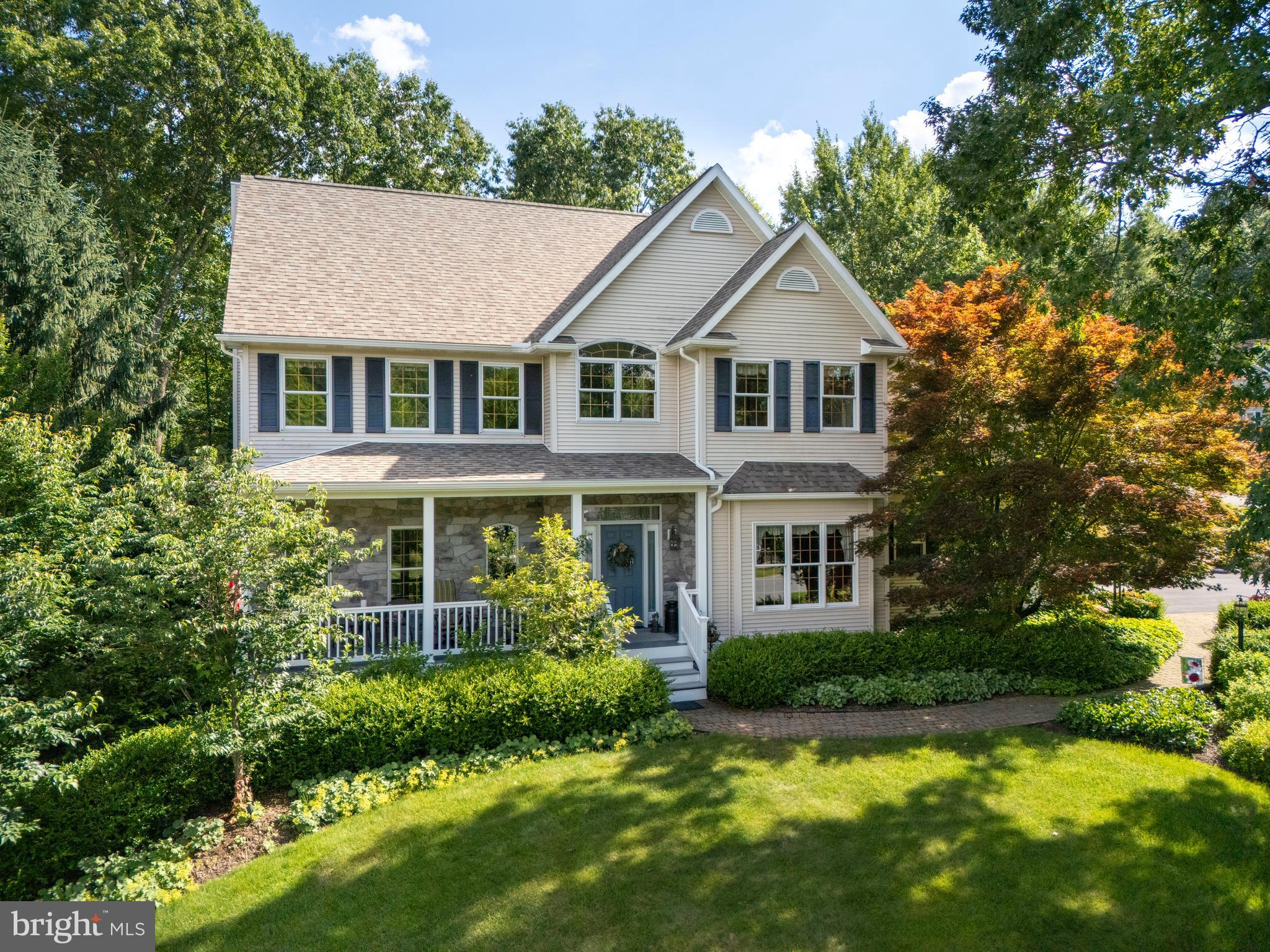 Welcome to this exceptionally maintained home in desirable Cedar Cliff, nestled on a beautifully landscaped 1.65-acre corner lot that feels like a private arboretum. Thoughtfully designed for indoor-outdoor living, you'll love the covered front porch, covered rear porch, and a serene outdoor entertaining area complete with an ornamental pond, stream, lighted waterfall and landscape lighting. The great room features a cathedral ceiling and striking stone fireplace, while the formal sitting and dining rooms offer elegant spaces for gathering. The eat-in kitchen includes updated appliances, a butler’s pantry, and scenic views of the backyard. Enjoy hardwood floors throughout most of the home, which offers a spacious owner’s suite with peaceful views and three additional bedrooms - one is an oversized bonus room with skylights. First floor oversized laundry room with a sink and built in cabinets, attached side entry garage with high ceilings and epoxied floor, as well as a matching shed with electric for the gardener. The walk-out lower level is plumbed for a bath and ready to finish. Recent updates include the roof, HVAC, kitchen appliances, and driveway and more. Close proximity to Penn State and neighborhood bike paths to PSU campus and Toftrees.