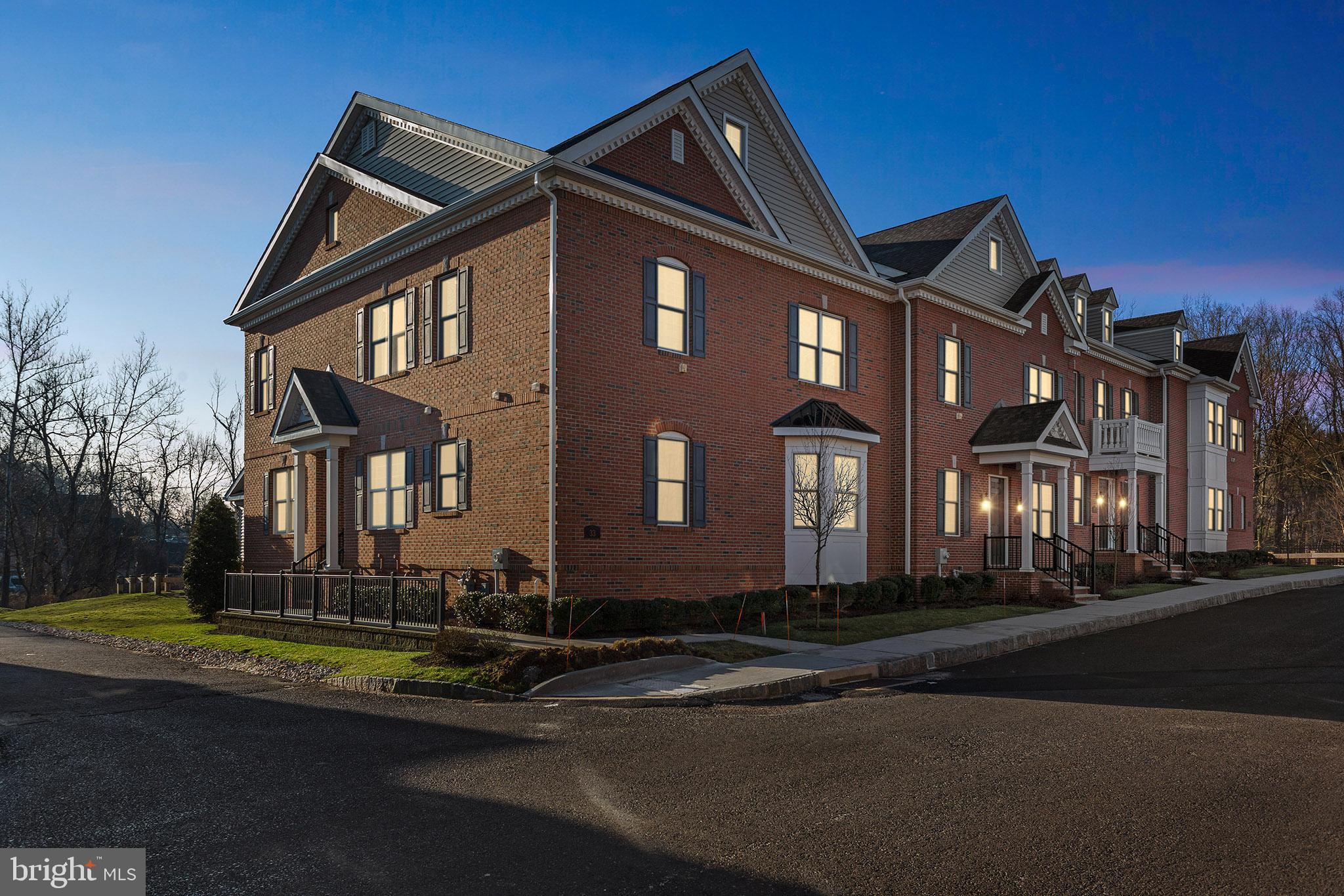 Walk to quaint Yardley Boro from this beautifully appointed home located within the highly desirable community of Yardley Walk. Built in 2017, this home features all of the fixtures and finishes of new construction. With over 3,000 square feet, plus a basement and deck, this expansive model offers the space to live the lifestyle you want. As you approach the home, appreciate the brick exterior and professional landscaping. Enter the foyer where you are greeted with hardwood flooring which flows throughout much of the space and a soothing color scheme. Host dinners in your formal dining room with a coffered ceiling, chair railing, and plantation shutters.  Continue to the heart of the home - the bright, spacious gourmet kitchen and inviting great room with gas fireplace. From the eat-in kitchen, step outside to your private deck, the perfect place to enjoy outside meals in the warmer months.  The open flow of the home lends itself to entertaining both inside and out. The main level primary suite boasts a tray ceiling, 2 walk-in closets, and a luxurious bath with a separate shower and soaking tub. A main-level laundry and powder room complete this floor.  The newly renovated second floor boasts a palatial modern bathroom with a laundry hookup. A large 2nd bedroom with an oversized walk-in closet and an open loft area complete this level. A thoughtfully finished basement offers 9 foot ceilings and a bar area with a wet sink, room for another bedroom, and a recently completed full bath and storage space. Upgrades also include smart home features such as indoor and outdoor security controls, keypad door locks, smart control lighting and thermostat, doorbell and camera. Benefit from easy access to I95, Philadelphia, Princeton, and NYC, while enjoying all of the charms of Bucks County living. Appreciate restaurants, shopping, and recreational activities in Yardley and surrounding communities. This community offers a convenient and beautiful walking path right into town for shopping and dining. All of this plus the highly desirable Pennsbury School District.