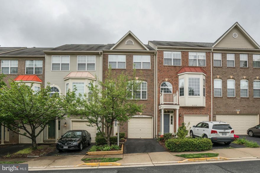 Convenient location near Dulles Town Center, Claude Moore Park  Recreation Center & restaurants.  This brick townhome has a generous sized one car garage, hardwood floors on the ML & the kitchen/Dr area, upgraded carpet & pad, large country kitchen with 42 inch cabinets-walk in pantry-desk area-ESIK-recessed lighting-gascooking,large deckw/patio below, vaulted ceilings, 9ft  Ceilings