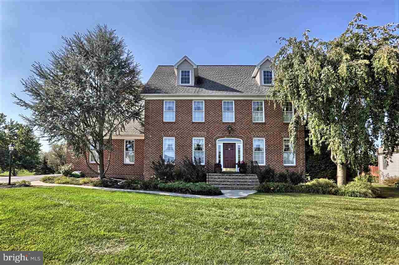 Classic brick-front colonial in Mayapple Golf course community is the perfect place to call Home! Gorgeous Kitchen with granite counters, tiled backsplash, Stainless Steel appliances, breakfast bar and pantry. Warm Family Room with wood-burning Fireplace. Custom trim and crown moldings accents throughout. Spacious Owner Ensuite and private Guest Ensuite. Finished walk-out Lower Level is perfect for entertaining and features a classic Pub Rm and large Game Room with generous workspace and coal stove. Full walk-up attic could be finished for additional living space. See Today!