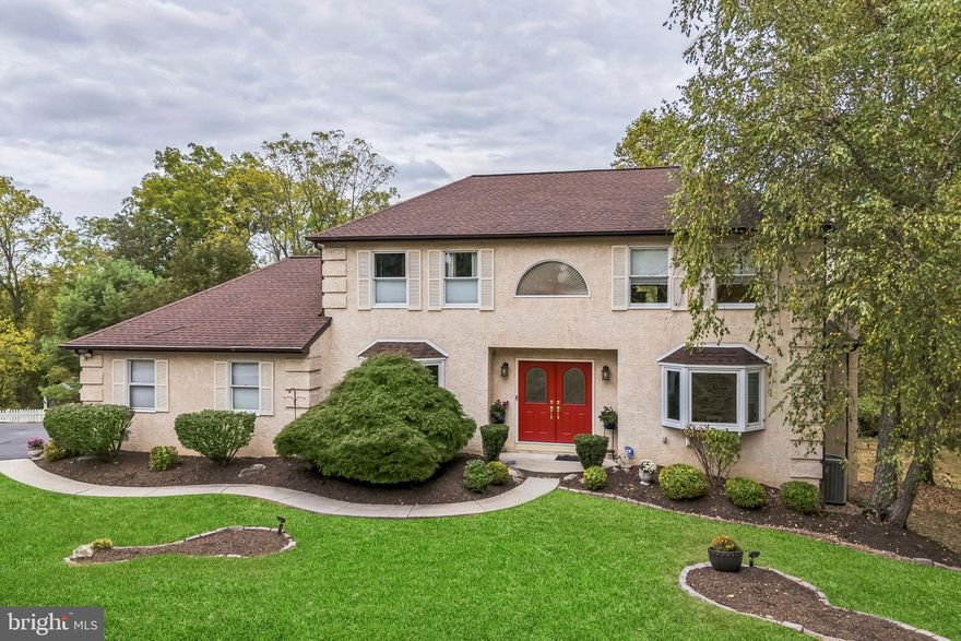 The perfect family estate awaits in East Norriton. Discover the serene charm of this two-story home, nestled in a picturesque bucolic neighborhood. With a backyard that adjoins the breathtaking 35-acre Ballard-Wolffe reserve, this residence offers a seamless blend of comfort and nature. Inside, you’ll find five spacious bedrooms and 2.5 elegant baths, perfect for accommodating family and guests. Enter into the center hall, two story, tiled foyer with a convenient coat closet and dramatic turned staircase. Off to the right, enter the formal living room complete with Brazilian cherry hardwood floors and a bay window that floods the room with natural light. The dining room also has the gorgeous Brazilian cherry hardwood flooring, a bay window and provides the perfect backdrop for hosting formal, family meals. Heading over to the remodeled eat in kitchen which is truly a chef’s dream. It features stainless steel appliances, granite counters, gas cooking, tiled backsplash, double ovens, and a built-in pantry. The kitchen also has a generously sized breakfast room with a huge window that drenches the room in sunlight and provides a spectacular view of the rear yard. The sunroom opens right up to the family room with freshly stained hardwood flooring, recessed lighting, a cozy wood burning fireplace that provides the perfect ambiance for any season and doors that take you out to the amazing outdoor living space. The first floor also provides access to the 2-car garage with a 220 outlet, a laundry room with utility sink, a powder room and bonus room which could be a 5th bedroom or office space. Heading up to the 2nd floor and the deluxe primary suite with ceiling fan, 2 California closets and a remodeled en suite bathroom with stall shower. There are 3 additional bedrooms which are all generously sized and all have ceiling fans as well as California Closets by Design. The hall bathroom was recently remodeled and services the 3 bedrooms. Heading down to the finished basement with a gas-burning fireplace, exercise room with recessed lights and separate bonus room that could be used for just about anything (craft room, playroom or home office). The basement also features a convenient double door walkout and a beautiful bay window, providing ample natural light and easy access to the outdoors. There are so many amazing features to this home, especially the outdoor space with a large two-story cantilever deck, which is the ideal spot for entertaining or simply enjoying the tranquil surroundings. The top deck invites perfect evenings of wooded privacy and spacious starlit nights with electronic remote-controlled awning along with 2 Wi-Fi spotlight cameras in the front and rear. Other amenities include WIFI Nest remote thermostat, newly resurfaced & sealed driveway, new smoke detectors on all 3 floors, new remote controlled ceiling fans throughout all upstairs bedrooms, new roof & gutter guards installed in 2014, new carpeting on the entire 2nd floor (2024) & brand newly repaired and resurfaced chimney. With its convenient location, abundance of space and natural setting, this home is more than just a place to live—it’s a sanctuary where nature and luxury meet. Schedule your showing today and enjoy your fabulous new dream home!