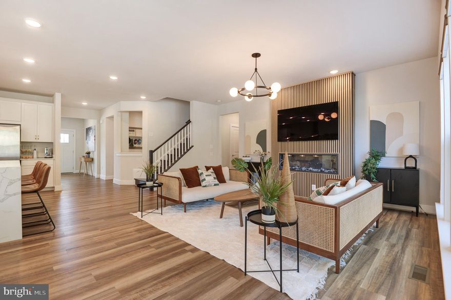 Surpassing all expectations, welcome to 17723 White Campion Way. This Potomac Shores residence is a flawless masterpiece, meticulously designed in every aspect. The rarely available Continental Model, constructed in 2022, sets the standard for perfection and could easily be mistaken for the community's model home.  Most furniture can convey.

This distinguished property boasts 5 bedrooms, 4.5 bathrooms, a spacious 2-car garage, an open floor plan, and numerous areas for hosting and entertaining. Upon arrival, guests are greeted by an inviting front porch that leads to a well-lit interior with 9-foot ceilings spanning all three levels and adorned with luxurious flooring and numerous upgrades. The gourmet kitchen is  centrally located and features an expansive island, quartz countertops, stainless steel appliances, a butler's pantry, ample cabinetry, and a generously-sized walk-in pantry. The entertaining spaces seamlessly flow through the first floor, anchored by a magnificent floor-to-ceiling custom fireplace. An office, powder room, and a mudroom off the garage complete this exceptional main level.

The upper level has been thoughtfully designed, with a versatile space at the top of the stairs. The primary suite is a sanctuary for relaxation, boasting a sitting area with a fireplace and a spa-like bathroom. Three additional bedrooms, two bathrooms, a laundry room, and ample storage closets round out this level.

The finished lower level offers a fifth bedroom with a separate walk-out door, a full bathroom, a spacious utility-storage room, and abundant space for entertainment or play. As an added bonus, the golf simulator/movie theater will remain for the fortunate new residents.

This distinctive property also features a sizable Trex deck at the rear, providing picturesque wooded views. Residents can take advantage of amenities such as pool access, the Fitness Barn, the Social Barn, and a plethora of neighborhood events throughout the seasons.  High-speed 1 GB FIOS internet is included.  Community amenities include public Jack Nicklaus Golf Course, scenic paths and trails, and the future VRE Station, town center, and more. Welcome home!