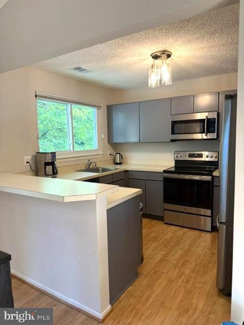 Photo of 11743 Summerchase Circle #B, RESTON, VA 20194 (MLS # VAFX2311178)