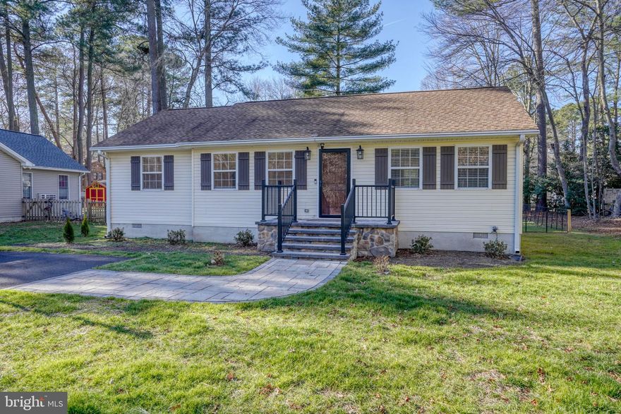 Affordable and serene living awaits with a Lewes address! This well-maintained 3-bedroom, 2-bath home is situated on a level quarter-acre lot. The front yard faces woods and trees.  This home offers a functional layout with generous outdoor space. Notable features include a shed for additional storage, a new driveway with ample off-street parking for 6 cars, and key upgrades that enhance comfort and peace of mind. Recent improvements include a beautiful Nico lock walkway and porch entry, installed new insulation, upgraded outdoor lighting, new LG washer and dryer, recessed interior lighting, and fresh interior paint throughout.  The rear deck is ideal for entertaining or relaxing outdoors. Enjoy quiet living with convenient access to shopping, dining, and nearby coastal attractions. Lochwood has its own website where buyers may register to receive up-to-date information.