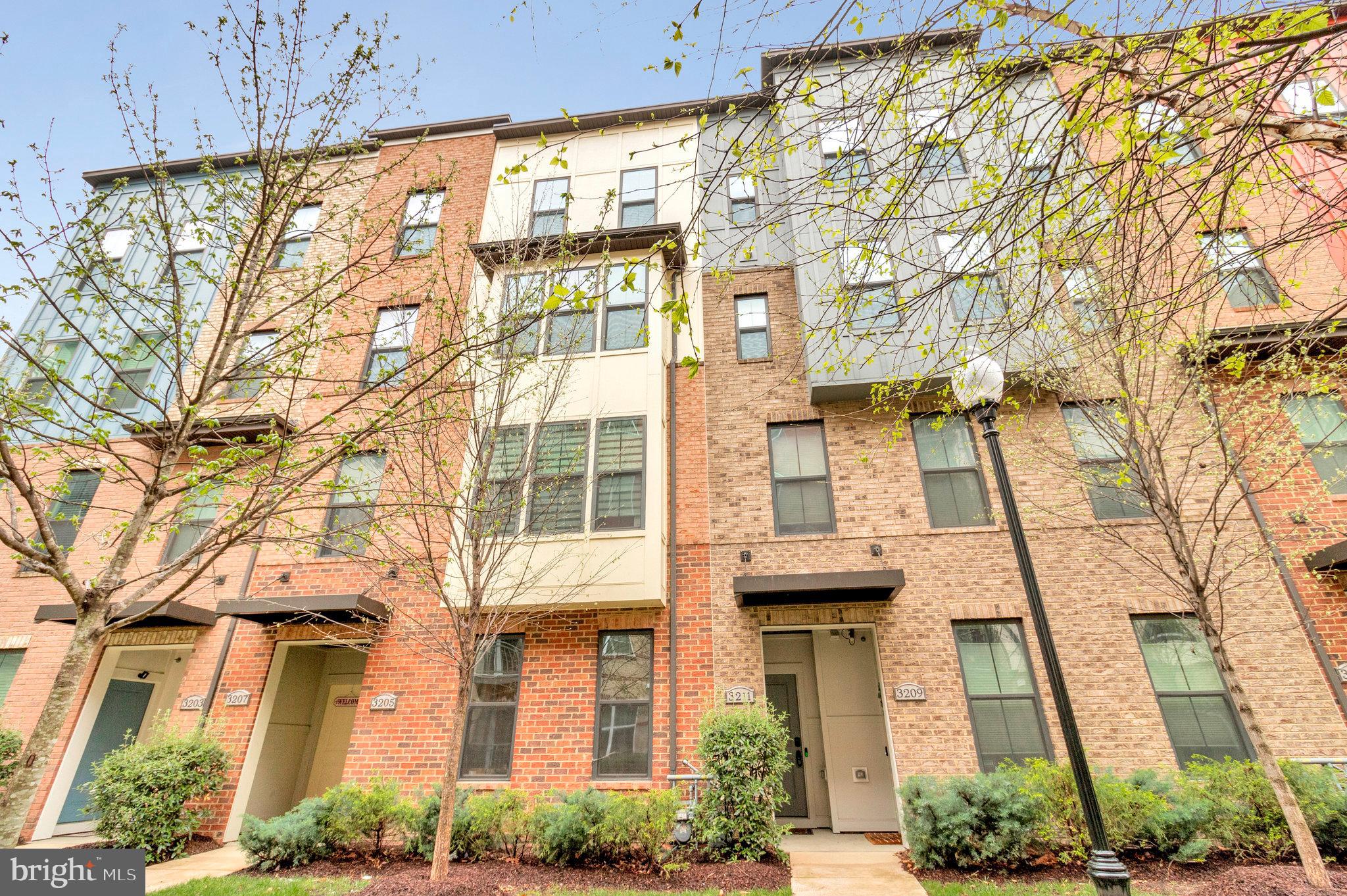 Welcome to 3211 Tribune Court Unit D in Hyattsville, MD—a beautifully upgraded 2-over-2 townhouse-style condo offering 2,819 square feet of stylish and functional living space. From the moment you enter, you'll appreciate the thoughtfully designed layout featuring a convenient main-level office, perfect for remote work or study. The luxury kitchen is a standout with granite countertops, stainless steel appliances, a garbage disposal, recessed lighting, a designer backsplash, a pantry, and an eating area that opens to a cozy balcony—ideal for both entertaining and everyday living. The open-concept design flows effortlessly into the living areas, offering plenty of space for relaxing and gathering. Upstairs, you'll find three spacious bedrooms and 2.5 bathrooms, including a primary suite with a large walk-in closet and a spa-like en suite bath complete with double vanities and an oversized walk-in shower. The two additional bedrooms are generously sized, providing flexible space for guests, hobbies, or a second office. Additional features include a Ring doorbell, an electric car charger, a 1-car garage, one driveway space, and an additional parking pass. Located just minutes from the Hyattsville Crossing Metro Station, with access to the Green and Yellow lines, commuting into D.C. or surrounding areas is quick and easy. You'll also enjoy being close to Whole Foods, The Mall at Prince George’s, three gyms, and a variety of restaurants and retail options. With its unbeatable combination of luxury finishes, spacious layout, and prime location, this home offers the best of comfort, convenience, and modern living.