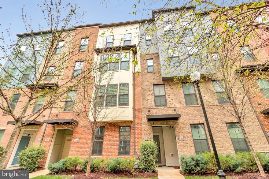 Welcome to 3211 Tribune Court Unit D in Hyattsville, MD—a beautifully upgraded 2-over-2 townhouse-style condo offering 2,819 square feet of stylish and functional living space. From the moment you enter, you'll appreciate the thoughtfully designed layout featuring a convenient main-level office, perfect for remote work or study. The luxury kitchen is a standout with granite countertops, stainless steel appliances, a garbage disposal, recessed lighting, a designer backsplash, a pantry, and an eating area that opens to a cozy balcony—ideal for both entertaining and everyday living. The open-concept design flows effortlessly into the living areas, offering plenty of space for relaxing and gathering. Upstairs, you'll find three spacious bedrooms and 2.5 bathrooms, including a primary suite with a large walk-in closet and a spa-like en suite bath complete with double vanities and an oversized walk-in shower. The two additional bedrooms are generously sized, providing flexible space for guests, hobbies, or a second office. Additional features include a Ring doorbell, an electric car charger, a 1-car garage, one driveway space, and an additional parking pass. Located just minutes from the Hyattsville Crossing Metro Station, with access to the Green and Yellow lines, commuting into D.C. or surrounding areas is quick and easy. You'll also enjoy being close to Whole Foods, The Mall at Prince George’s, three gyms, and a variety of restaurants and retail options. With its unbeatable combination of luxury finishes, spacious layout, and prime location, this home offers the best of comfort, convenience, and modern living.