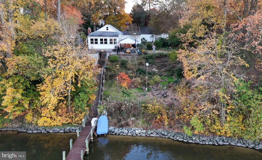 COMING ON THE MARKET FRIDAY, 3/27!!  PICTURES WILL BE UP BY THEN AS WELL.  
*****OPEN HOUSE - SUNDAY, 3/29 FROM 2-4 PM ****. Don't miss this opportunity to own a deep water waterfront home on Stony Creek - Close to the Patapsco River!!  

Fully renovated in 2019, this wonderful waterfront ranch offers over 198' of deep water frontage (bring your sail boat) and the perfect blend of modern comfort and serene coastal living. Featuring 3 bedrooms and 3 full baths, the open floorplan is thoughtfully designed to capture stunning water views from the main living spaces.

The bright white galley kitchen with crisp cabinetry flows seamlessly into the spacious living and dining areas, making entertaining effortless. A charming wood stove adds warmth and character, creating a cozy focal point while maintaining the home’s clean, updated aesthetic.

Step outside to your private outdoor oasis. The covered deck overlooks the water—ideal for morning coffee or sunset gatherings. A tranquil 5,000-gallon koi pond provides a peaceful setting perfect for relaxation and meditation. Boating enthusiasts will love the private deep-water pier equipped with a 16,000-pound double I-beam sailboat lift, a 12,000-pound pontoon boat lift, and the original covered area for added storage and charm.

Additional highlights include an oversized 2-car garage offering ample space for vehicles and storage, plus an Amish-built 12x24 shed for even more versatility. Situated on a private lot with a quaint fenced area, this remarkable property delivers the ultimate waterfront lifestyle with privacy, functionality, and timeless appeal.