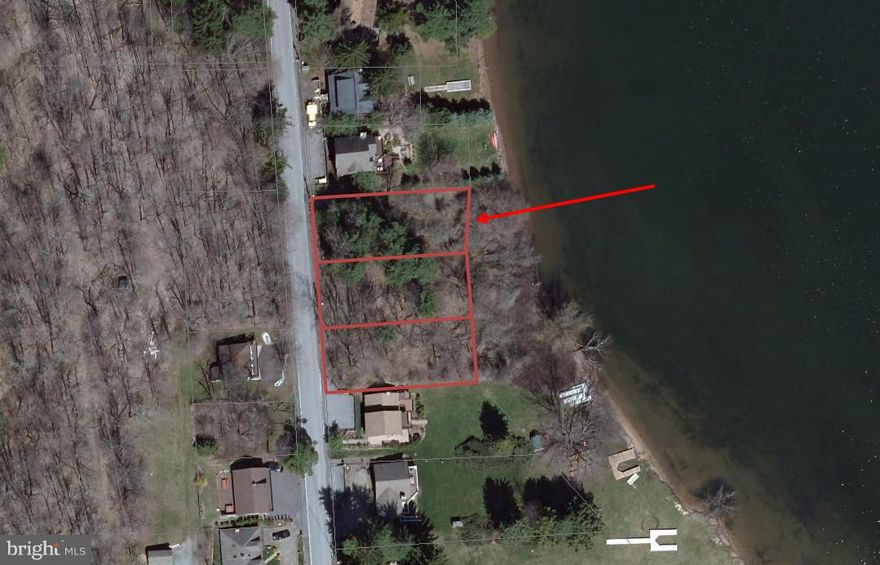 Here is your chance to build your dream home directly on Deep Creek Lake, at the base of Wisp Ski Resort.  60' of lake frontage, wooded lot, qualifies for a 1 powerboat and 1 PWC Type-A Dock permit.  Incredible opportunity to build your dream home, or an investment rental home in a prime location.  2 additional adjoining 60 foot wide lakefront parcels also available.  Call today!