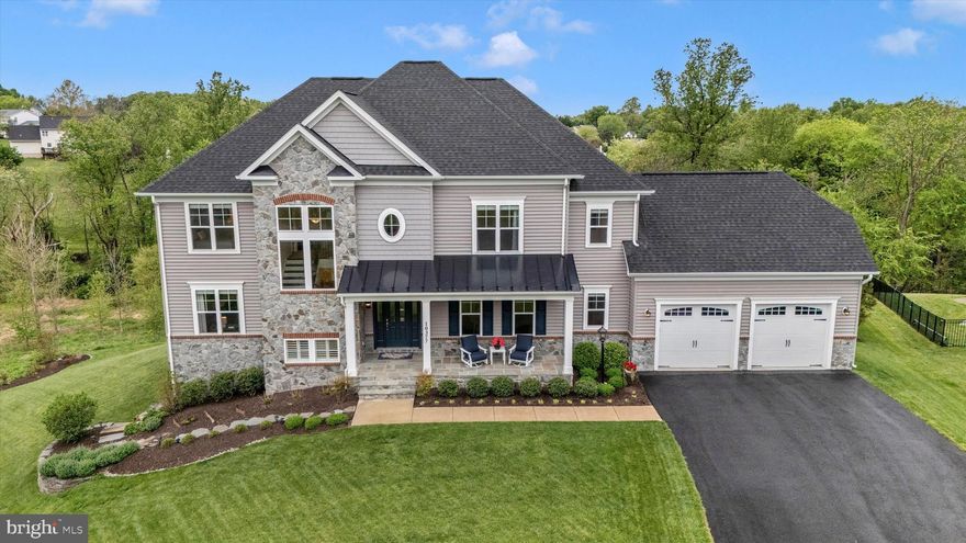 Welcome home to 10377 Springside Terrace! This stunning 6 bedroom 4 1/2 bathroom home, in the esteemed Spring Hollow community of Ijamsville, is everything you could dream of and more! Arriving to the home you'll appreciate the beautiful neighborhood setting as you journey to the end of a quiet cul-de-sac and are greeted with the home's lovely curb appeal and inviting covered front porch. Stepping into the main level of the home you have your formal living room, executive office, guest half bath, and open concept great room with a cozy gas fireplace, floor-length windows and glass patio door that let in ample sunlight and showcase the amazing views, yet offer powered blinds for when you're ready to turn in for the evening. The wonderful great room then flows into your breathtaking kitchen with large center island and extended buffet counter, all featuring soft close cabinets and drawers. Included in the kitchen is your large informal dining area, which opens directly to a lovely screened porch with tree-lined views by day and amazing sunsets at night! The kitchen also offers access to your mud room with double-door pantry and your formal dining room with custom wall-to-wall built-ins offering plenty of extra storage space. Making your way to the upper level you'll find your owner's suite featuring a large walk-in closet and luxury spa bathroom, complete with stand-alone soaking tub. The upper level also features a secondary suite with private full bath, and two additional bedrooms with a shared access full bath. Lastly the upper level offers a large laundry room with a mud sink and extra storage space. Arriving to your lower level you will find a wonderful rec room with a wet bar, two additional optional bedrooms - currently used as a den and an exercise room, a full bath, a large storage and utility area, and sliding glass door access to your rear patio outside. Last but not least you can make your way outside where you'll find a lovely screened porch, additional upper level deck, expansive lower level patio, a two car garage, stunning landscape, and a gorgeous tree-lined view. All of this in an unbeatable location with easy access to shopping, dining, and major commuter routes - plus being zoned for all Oakdale schools! You won't want to miss your opportunity to call this dream home your very own!