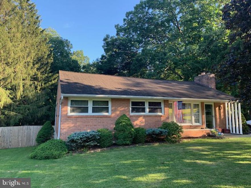 Welcome Home! This charming brick rancher in the heart of LaVale is what you've been waiting for. The main level has hardwood floors, a gas fireplace in the living room, kitchen, 3 bedrooms and a full bath. There is a finished lower level family room with built-ins. The basement also offers a full bath and a large unfinished space to create the space you want and great storage possibilities. Outside is where the magic happens. There is a large screened-in concrete patio area that has cable so you can relax and watch your favorite show in your private outdoor space. There is a fenced in yard and a walk down area that goes to the stream that runs at the bottom of the property. The detached garage is connected to the screened patio. There are just too many nice features to list so make your appointment and come see this gem for yourself.