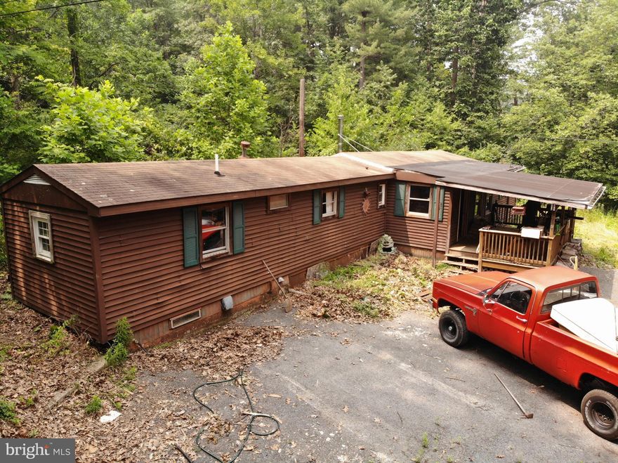 Great opportunities here for investors or anyone who wants a project.... sitting on  this 1.51 acre with privacy.   home includes two bedrooms, one bath,   detached one car garage with a two room studio apartment with full bath  for extra  income or in-law suite.   Septic system and well on property .   single wide mobile pre 1978, needs work. Studio apartment above garage  elect. baseboard heat .  Age of home is approximate. Title is retired. Properties tenant occupied currently. Heat is pellet stove but tenant may be taking it with him upon move out