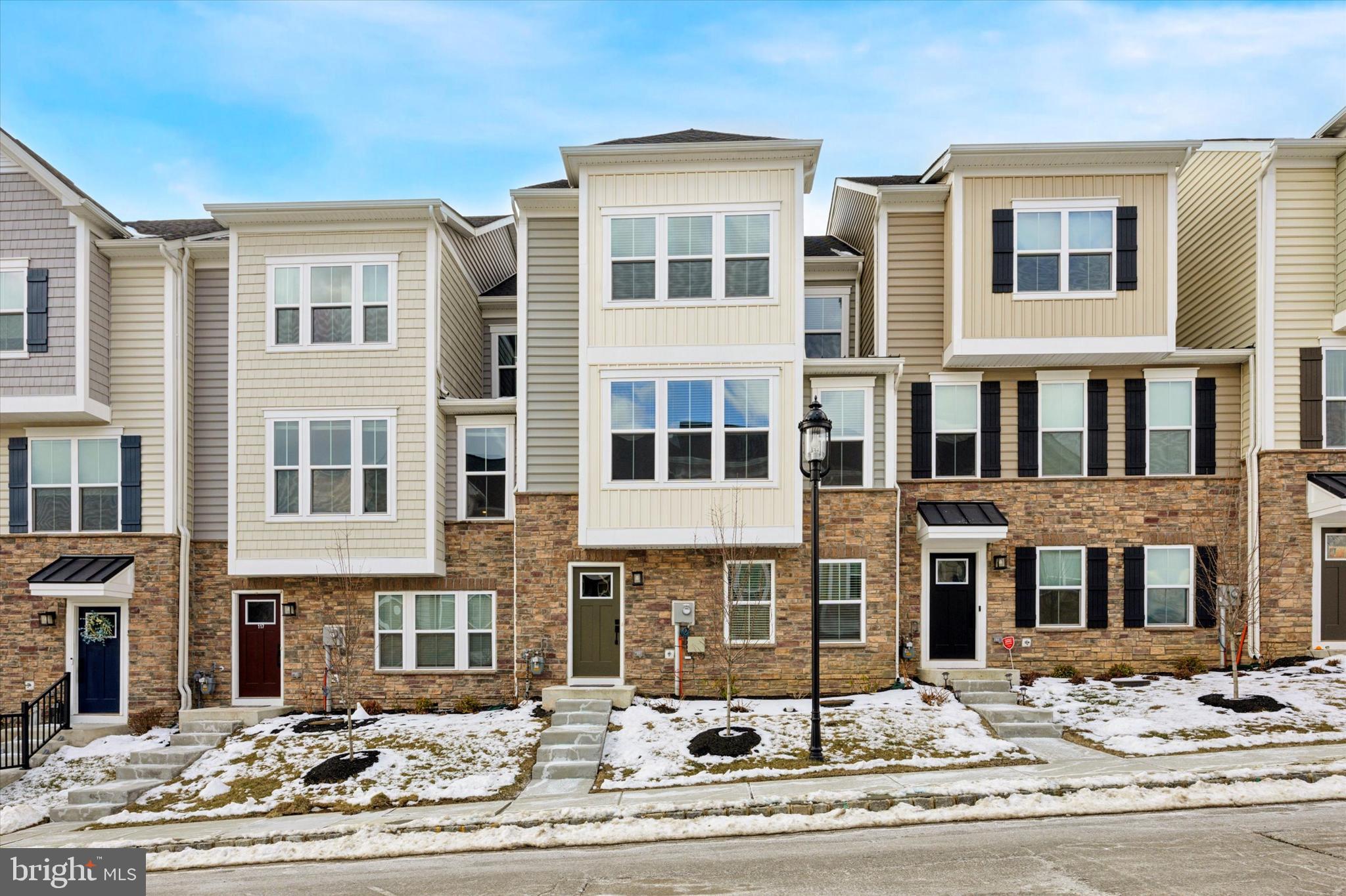 Welcome to this nearly-new, beautiful townhome in the desirable Ponds Edge community! Built in 2023, this three-story stacked townhome is AVAILABLE FOR SALE AND FOR RENT; with 4-BR and 3.5 BA, features a comfortable open floorplan and 2,400 sq. ft of thoughtfully curated space. Enter the home & you’re greeted into the foyer on the lower level. Take in the spacious 9 ft ceilings, gorgeous engineered oak HW floors, recessed lights & neutral paint; all which extend throughout the whole home (unless otherwise stated). Hosting traveling guests is a breeze with the lower level 4th BR, featuring expansive windows & the generous closet. Additionally, there is en-suite access to a full bath featuring a tub-shower, modern vanity with quartz top, vanity lighting, tile flooring & additional hallway access. Rounding out this level is a large finished storage room, mechanical closet, & built-in bench seat with coat rack; perfectly located by the garage door entrance. Head upstairs via the oak stairwell & enjoy the open concept floorplan. An impressive great room flows seamlessly into the dining room & kitchen. Privately tucked away, the 2nd floor also features a ½ bath. Engineered HW floors highlight the space; while ample light pours in from the expanded windows & sliding door to balcony. The gourmet kitchen has everything you're looking for: Calacatta quartz counters; Mahogany, slow close cabinets with upgraded trim & molding; 4-5 person center island; SS Appliances with gas stove & range hood; subway tile backsplash; pantry closet; & bonus pendant lights above the island. Access the covered balcony via the sliding doors from the kitchen & enjoy outdoor living! Thoughtful upgrades here include a built-in vented gas fireplace, recessed lighting, a tasteful stone accent wall, & maintenance-free weatherproofed floors - all which make this an ideal space for hosting & gathering throughout the year! Back inside; on the 3rd floor find the primary BR featuring a tray ceiling, huge windows & large walk-in closet. The owner’s en-suite full bath offers a dual-sink mahogany vanity with quartz top, vanity lights, a spa-like, glass-door double shower with bench seating, & tile floors. Two additional BR’s with spacious closets are located on this floor. They share the hallway full BA, with tub-shower, vanity with quartz top, vanity lighting & tile floors. Lastly, on the 3rd floor find the convenient laundry room as well as a linen closet. The property has a 2-car garage with a 2nd mechanical room, & extra driveway parking. Enjoy the convenience of only 2-yrs young utilities, Smart home features such as NEST thermostat & a transferable structural warranty from NV Homes. The HOA offers a clubhouse/fitness center, playground, jog/walk path, snow removal, & more. Best of all, this home is walking distance to Ducklings Early Learning Center, a moments drive to the new Wawa SEPTA train station & less than 10 min to Media Borough. Don't wait to make this gem your own! Schedule your tour today!