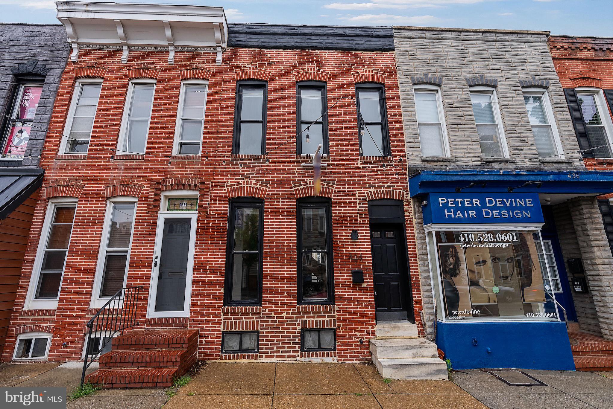 Welcome to 434 E Fort Avenue, ideally located in the heart of Federal Hill/Riverside! This charming 14-foot-wide row-home offers the perfect blend of character and convenience, featuring a private parking pad, 3 bedrooms, 2.5 bathrooms, a rooftop deck, and over 1,900 square feet of living space. The main level showcases hardwood floors, a spacious living room with a cozy fireplace, a separate dining area, and an updated kitchen complete with stainless steel appliances and granite countertops. Upstairs, you'll find two bedrooms and two full bathrooms, including a primary suite with a private ensuite bath. Walk up to your rooftop deck and enjoy panoramic city views, perfect for entertaining or relaxing above the vibrant cityscape. The finished lower level adds versatility with a third bedroom or family room accented by exposed wood beams, along with a laundry/storage room. Enjoy the ease of off-street parking and a location just steps from the Inner Harbor, dining, shopping, and minutes from major commuter routes. Don’t miss this incredible opportunity to own in one of Baltimore’s most desirable neighborhoods!
