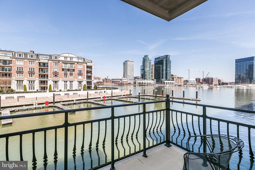Welcome to Inner Harbor waterfront luxury living at its' finest.  Located behind the entry gates of Ponte Villas North this home offers unmatched privacy and security.  This rarely offered North Pier premium end unit location features a five level elevator and spacious rooftop terrace.  Spectacular panoramic direct waterfront and city skyline views abound from all levels of this 3,125 square foot Pier Home.  This pristine condition home features an abundance of exquisite finishes including three overwater balconies, gourmet kitchen with stainless steel appliances, gas cooking & granite counters, hardwood flooring, wet bar and a gas fireplace.  The fourth level features the second bedroom and spacious family room.  An easy conversion of the family room can provide a dedicated third bedroom.  Parking for two vehicles is provided for within the attached two car garage.  Community amenities include 24/7 security, a private guest parking garage, outdoor pool, private fitness center, concierge services, multiple restaurants, marina, dock bar and beautifully landscaped grounds.  A conveniently located water taxi can take you to explore any neighborhood in the city.  With countless shopping, dining and entertaining options just minutes away from this centrally located Inner Harbor property you can enjoy a lifestyle offered nowhere else in Baltimore.