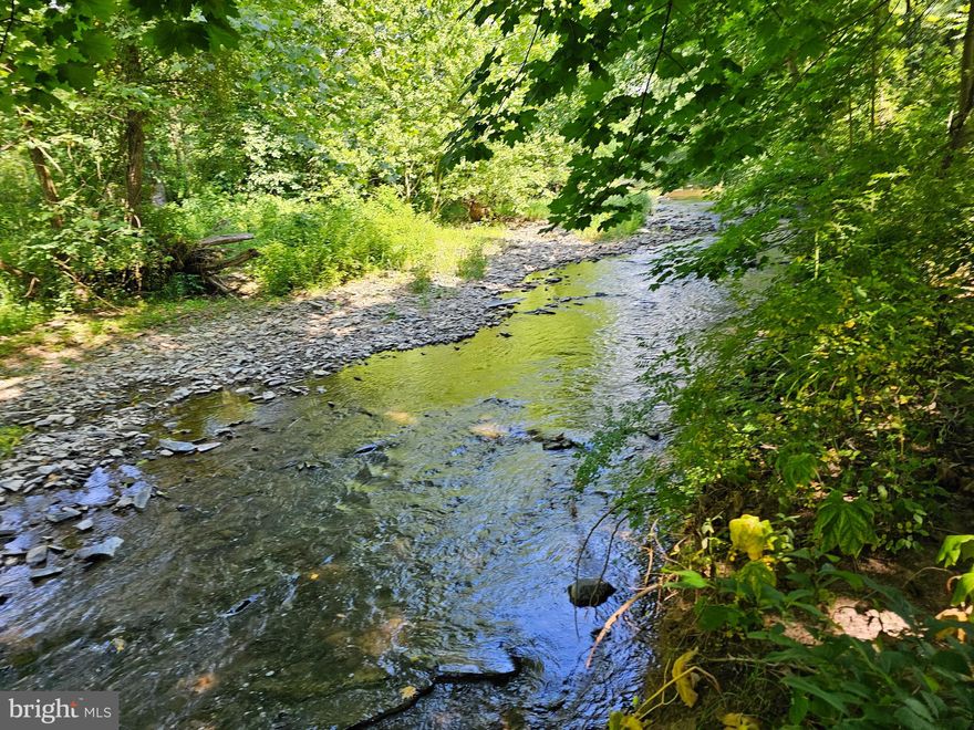 Discover the perfect blend of natural beauty and practical amenities on this serene 4-acre property nestled along a picturesque creek in Duncannon, PA. Whether you're seeking a peaceful retreat or a place to call home, this property offers a wealth of possibilities. With two spacious 2-bay garages, a well, and a septic system, all your essential needs are covered. There's also a ready-to-use spot for a mobile home or potential "tiny home", making it ideal for immediate occupancy or as a temporary dwelling during construction. The lush, wooded land provides privacy and tranquility, while the creek frontage offers soothing sounds and scenic views. This property holds great potential for building, subject to municipal approval. Embrace the opportunity to create your own private sanctuary or explore the investment potential of this unique property in the heart of Perry County, PA. Don't miss out on this rare offering – contact us today for more information or to schedule a viewing!