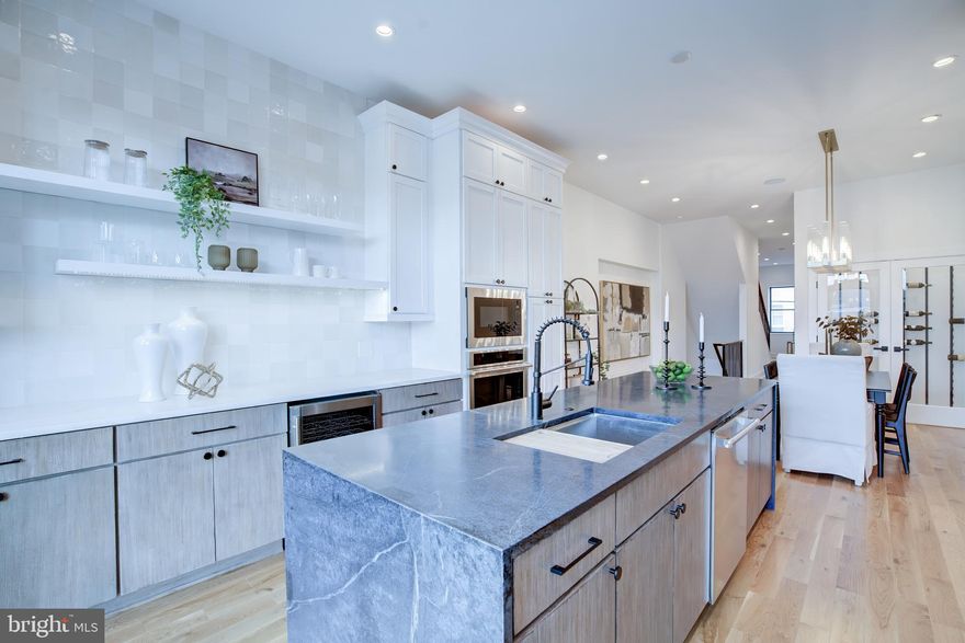 The List Price is the Opening Bid Price for the Live Bidding/Auction (please read below for more details).

Experience the pinnacle of urban living with this extraordinary 5-level luxury townhouse located at 1210 S Highland Ave, in the vibrant Canton neighborhood of Baltimore, MD. Crafted by Chance Development, this unique home offers a blend of style and convenience, encompassing approximately 4,100 sq ft of sophisticated living space.

Featuring 4 bedrooms, 4 full and 2 half baths, this property is designed for comfort and elegance. The first floor includes a versatile office/bedroom, a mudroom, and a full bathroom. The second level, with its soaring 11-foot ceilings, showcases a stunning gourmet kitchen with French doors opening onto a deck, a spacious dining area, and a large living room complemented by a half bath.

The third level is dedicated to peaceful rest, hosting 2 bedrooms, 2 full baths, and a laundry room for added convenience. Ascend to the fourth floor to find a bedroom, full bathroom, and a wet bar, leading to an awe-inspiring rooftop deck that presents breathtaking city and water views.

The finished basement enhances the living experience with a state-of-the-art theater room, featuring surround sound, a half bath, and a wet bar. This home is finished with top-tier systems, materials, and fixtures, including Marvin windows and doors, spray foam insulation, a comprehensive home audio and security system, two high-efficiency gas furnaces, smart thermostats, and heated floors.

Outside, the oversized 1-car attached garage, additional rear parking, and the convenience of a centrally located 5-stop elevator (included on offers that meets sellers reverse) complete this exceptional home. Nestled in a prime location, you're just steps away from restaurants, shopping, Canton Crossing, and major highways. Don't miss the chance to own this remarkable property, where luxury meets functionality in the heart of Canton.

Online Bidding will start on Tuesday December 12, 2023 at 8:00 am and continue through Friday December 22, 2023 at 6:00 PM. Sellers reserve the right to accept, negotiate or reject any pre-auction offers or online bids – at sellers sole discretion. Pre-Auction Offers are encouraged and will be considered until 12/11/2023 at 8:00 pm.