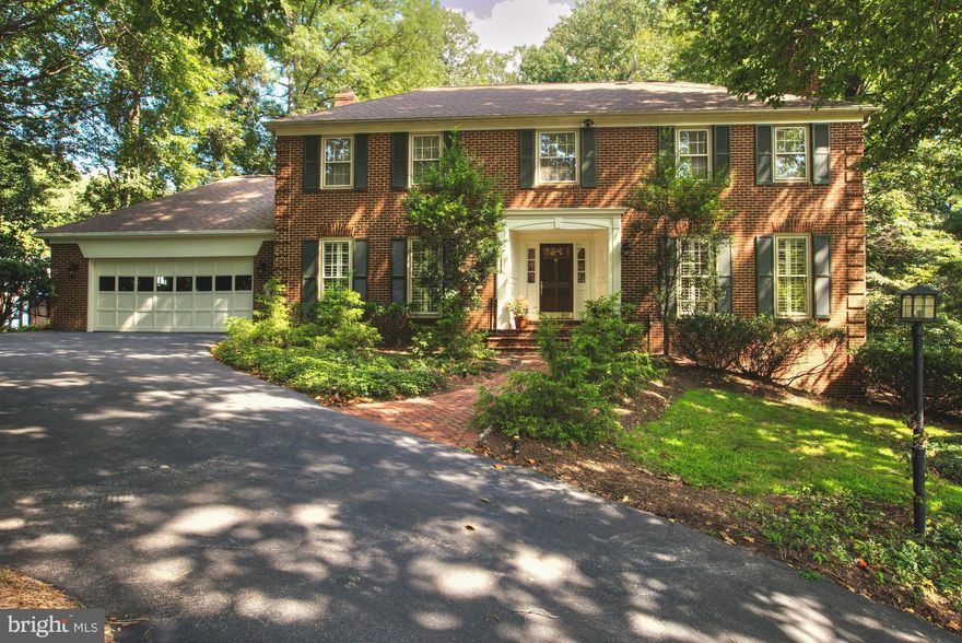 Beautifully updated all brick Georgian colonial handsomely sited on over half acre treed lot * Completely renovated kitchen with granite, stainless steel appliances, Subzero & six burner gas cooktop * Renovated baths * Hardwoods on main & upper levels * Three masonry fireplaces * Expansive lower level with 5th bedroom & full bath * Library with built-ins * French doors to deck & private backyard