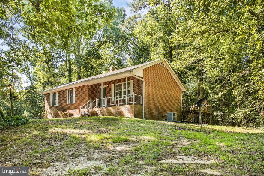 This brick rambler rests amidst the privacy of tall trees on 2.19 acres just outside of the Town of Montross. Two Bedrooms and Two full Bathrooms on the main level and a full basement with workshop potential, parking for 1 vehicle and Two Bonus Rooms that are ideal for craft rooms, offices or additional storage.