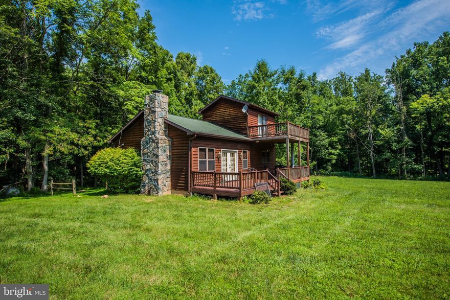 HUGE PRICE REDUCTION! The Peaceful Cacapon River. Cedar sided, 2bdr, 2ba, solid walnut flooring, Stone fireplace, observation deck for star gazing. All await you on 4.31 acres with 356 feet on the beautiful Cacapon River. New Roof and Front Door,  Make your appointment today!