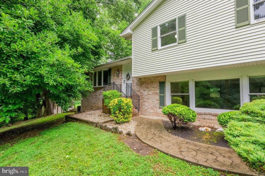 Gorgeous and lovingly maintained home that is both a retreat and an oasis.  Back on the market with a brand new  HVAC and a price correction--new season, new price! This gem will not last long! From the driveway, enter into a large entertainment space/second living room with a pellet stove.  Adjacent to the entertainment space is a living room/family room with a wood-burning fireplace and half  bath. Up a few steps to your large, eat-in kitchen with tile work for counter space and tiled floor.  The kitchen has a wonderful skylight over the Jenn Air burner.  The kitchen is adjacent to a good-sized summer porch and large trek deck.  A formal dining room is located off the kitchen with hardwood floors in excellent condition.  Wonderful retreat space outside with nature at your door.  Four ample-sized bedrooms upstairs. Two bathrooms upstairs, one with a jetted tub and shower.  Main bedroom is very large with a walk-in closet and armoire, skylights.  Main bath has a soaker tub and shower. Laundry room is upstairs with W/D.   Central Air throughout house but Master BR has its own stand-up AC unit that conveys with the house. Seller will leave. Sellers have maintained the house with updates, recently replaced roof, osmosis system with well, new water heater. Attic storage. Eight ceiling fans throughout. This house is a gem and can be your home. The basement is partially finished with carpeting and has an outdoor entrance to a walkway and a shed. Warranty offered. HVAC new in September 2024.