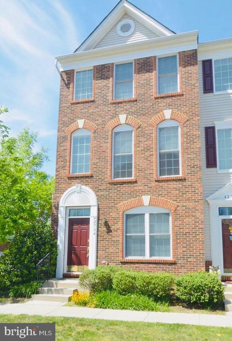 Beautiful  large end unit 3 level brick front townhouse condo with a rear entrance 2 car garage.
This is a highly sought-after area at  Amberlea South Riding! 
2 Master Bedrooms upstairs, each with its own  dedicated bathroom. Gorgeous large kitchen with granite counter-tops, Stainless Steel appliances,Large open living room, dining room, balcony on main level off of kitchen. 
Entry lower level  bedroom with its own dedicated bath, laundry + 2 car garage.
 Pool close by, as well as shopping, restaurants, schools.
* Water and Trash  included