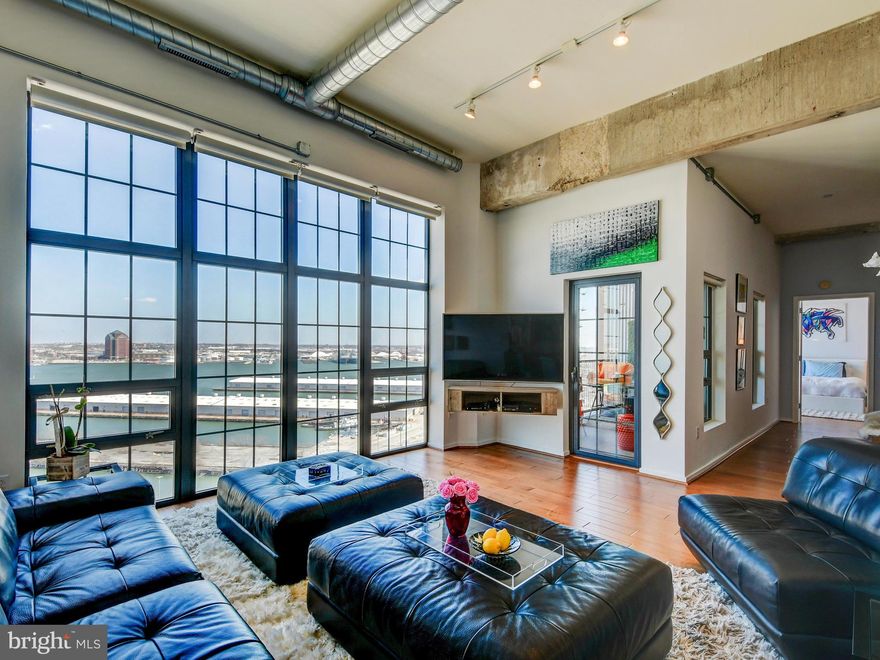 High ceilings, expansive views and floor-to-ceiling windows make this 1 bed / 1.5 bath condominium one of a kind!  Meticulously maintained, light-filled and high-end finishes like granite counters, stainless appliances and beautiful wood flooring.  Enjoy the impressive views of the Baltimore Harbor from your private balcony.  Full service, luxury condominium building in one of Baltimore's most popular neighborhoods.  Amenities that include 24/7 front desk staff and fitness center, Sky Lounge, secure parking and more!  Close to 95, Under Armour, shops, parks, entertainment and restaurants.