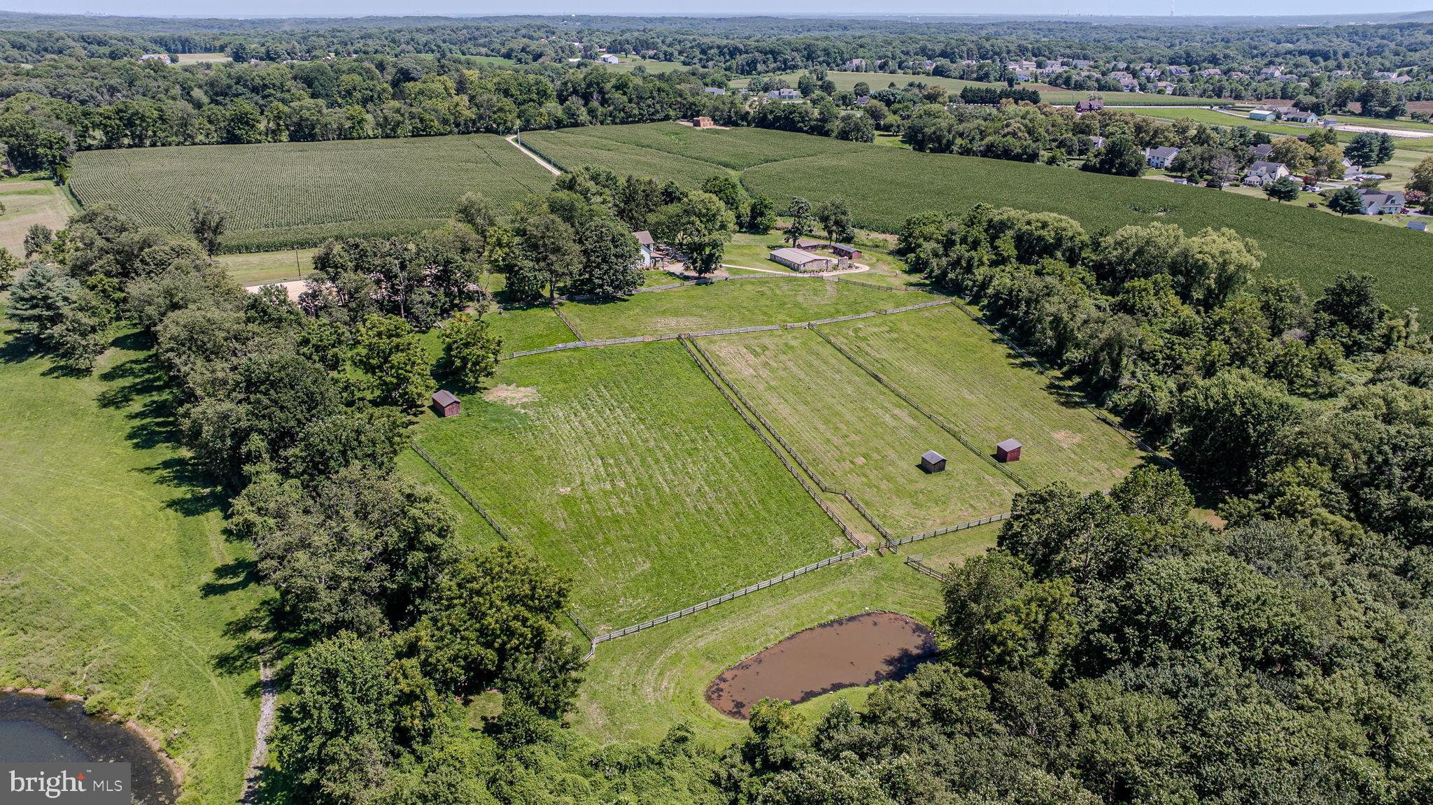 Tucked away down a long private lane on 11.5 serene and secluded acres, this charming farmette offers privacy, breathtaking views, and a lifestyle you’ll never want to leave. The beautifully updated three-story fieldstone farmhouse has been meticulously renovated within the past 10 years, receiving a new roof, heat, plumbing, electric, kitchen, baths, and refinished original hardwood flooring—all blending modern convenience with timeless character.
Equestrians will appreciate the thoughtfully designed barn complex, complete with five matted stalls, tack room, feed room, hay storage, and grooming areas. The historic stone barn ruins have been revitalized to enhance the beauty of the horse stables, and the accompanying shedrow barns add to the functionality of the equine improvements. Approximately 9 acres are cross fenced into 6 connecting pastures with 3 turnout sheds, offering plenty of room for your horses to roam—and space to add an additional pasture if desired.
The property also boasts a 100' x 200' sand arena with lighting, perfect for training and riding day or night. All of this is ideally located just a hack away from Fair Hill, making it an unparalleled opportunity for horse lovers seeking both convenience and country living.
DO NOT enter property without permission, shown by APPOINTMENT ONLY.