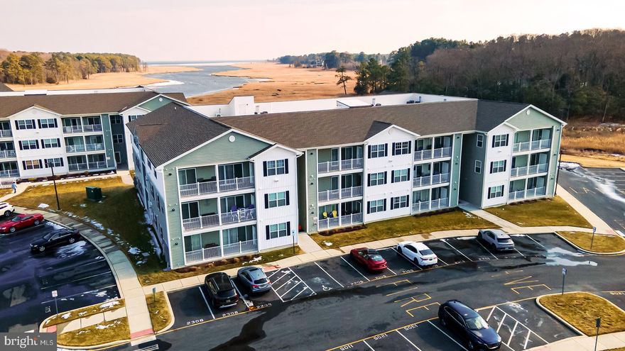 Experience coastal living at its finest in this beautifully maintained 2nd-floor condo offering spectacular views of Love Creek right from your private deck. Whether you're seeking a personal getaway or an investment opportunity, this property boasts excellent rental potential with a 7-night minimum and is offered turnkey and fully furnished—ready for immediate enjoyment.
Located in a secure building with elevator access, this pristine residence features an open floor plan designed for comfort and entertaining. The welcoming entrance flows seamlessly into the spacious kitchen and living area. The kitchen is well-appointed with stainless steel appliances, a gas range, abundant counter and cabinet space, a pantry, and a breakfast bar with seating.
The light-filled living room offers a sliding glass door that opens to the deck, where you can relax and take in the serene water views. The primary suite features an ensuite bath with dual vanities and a step-in tiled shower. The guest bedroom also enjoys direct deck access and beautiful water views—perfect for visitors. A full-size stackable washer and dryer are conveniently located within the unit.
Ideally situated close to the community pool and clubhouse, this condo is just minutes from downtown Lewes, the Rehoboth Beach Outlets, popular dining and entertainment, and the pristine shores of Delaware Beaches. Enjoy crabbing, fishing or kayaking on Love Creek directly from the dock where there are boat slips available. Enjoy easy access to boating, coastal adventures, and everything that makes living the salt life so special.
Don’t miss this opportunity to own a slice of waterfront paradise!