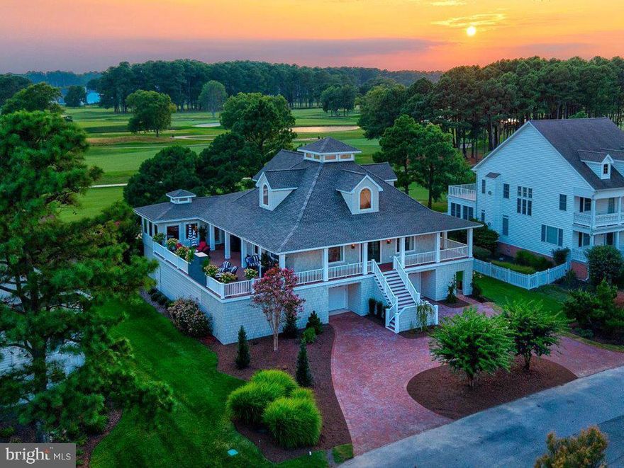 Welcome home to 156 East Side Drive, Rehoboth Beach Yacht and Country Club, featuring a gorgeous golf-front setting, bay views and stunning interior and exterior spaces .  This home is perched atop the manicured fairways of the exclusive, private golf course, with distant views of Delaware's most breathtaking club house.  The finishes throughout the just completed thorough transformation of this exceptional property were carefully curated and sourced to bring this designer's dream to life.  Only the very finest appointments were utilized to complete this masterpiece of casual luxury.  The exterior features maintenance-free Nu Cedar siding with wrapped columns, Timbertech Vintage Mahogany decking and a stunning Outdoor Fireplace.  The expansive deck also features beautiful bay views over lush landscaping and a just completed brick circular driveway.  The interior details include tasteful and  timeless choices such as unlacquered Newport Brass fixtures, marble countertops, and custom inset cabinetry throughout. Guests are greeted at the main entrance which opens to a spacious great room  with loads of large windows and soaring ceilings, making this room a stunning unique exception to other homes you may have seen.   An impressive fireplace featuring beautiful marble surround, large picture windows, custom raised wood paneled details, and versatile spaces were created within this wonderful open entertaining space.  The premium kitchen is sure to delight the most discerning chef - with an impressive island, views overlooking the golf course, two sinks, two Cove dishwashers, Wolf range and double ovens, Custom Decorative Hood accent, Herringbone marble backsplash, and more.  An adjacent coffee/wine bar buffet offers a 3rd sink and Subzero beverage center.  Just off the kitchen, you will find a sunroom drenched in natural light with classic wood wall and wood plank ceiling finishes.  This room has a private entrance to the deck and also pocket door separating it from other living spaces.  The newly created Owner's Suite provides a perfect spa-like retreat, with large windows, access to the rear balcony, spacious dressing room/walk-in closet, and a glamorous en suite bathroom with large marble shower, marble walls to the ceiling, heated flooring, gorgeous powder blue custom cabinetry and high quality fixtures.  The guest bedroom on this level offers a large en suite bath with walk-in shower, and access to the classic wraparound covered porch.  Upstairs you will find a private. spacious second en suite bedroom with built in cabinetry, a masterpiece bathroom and expansive closet spaces.   In addition to the grand exterior stair entrance, owner's will enjoy the convenience of entering through the enclosed and finished garage space offering a separate secure storage area.  This lower level of the home offers a large bedroom / game room with separate exterior entrance; a spacious laundry and hobby space with full size refrigerator, cabinetry and sink; a full bath with tiled shower; office/den space; two conditioned storage rooms; staircase and elevator.  This lower level can easily be utilized as  staff quarters, an in-law suite, or another private spot for guest accommodations.  Every part of this exquisite home exudes comfort and style - an apt setting to enjoy the lifestyle of the community and Rehoboth Beach with its award winning beaches, diverse culinary scene, iconic boardwalk and Delaware's no sales tax shopping.  5th bedroom was transformed into Owner's dressing room/ walk-in closet - could easily be converted back to a 5th bedroom if preferred by new owner.