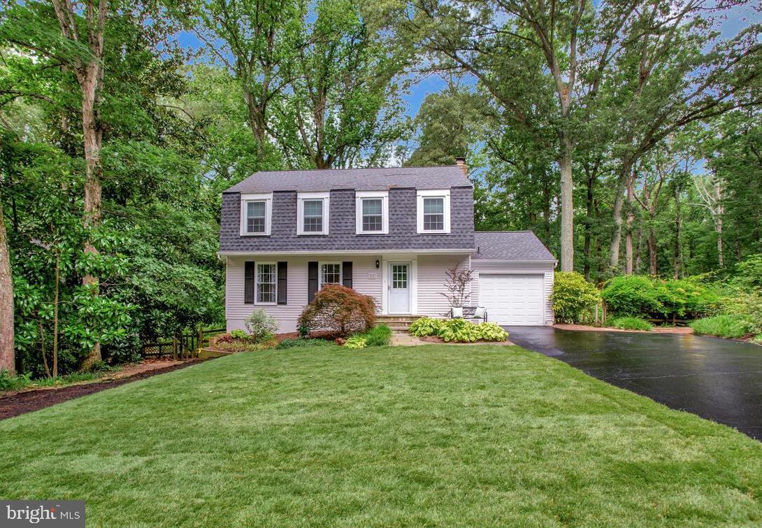 This lovingly maintained Dutch Colonial home offers timeless charm blended with modern comfort in the community of Bay Hills. Featuring 4 spacious bedrooms and 3.5 well-appointed baths, this home is designed to accommodate a busy lifestyle with grace. The main level boasts a bright, expansive living room, a separate formal dining room, half bath and a cozy family room with a gas fireplace that opens to a deck—perfect for relaxing or hosting guests. The kitchen includes a convenient breakfast bar and flows seamlessly into the living spaces. Upstairs, the generous primary suite features a private bath, while all bedrooms offer ample space and natural light. The finished lower level includes a full bath and walk-out access to a patio and the lush rear yard. The multi-levels of decking is ideal for extending the party outdoors. The one car garage provides built-ins and access to the house. Some updates include, a new roof, sprinkler system, refinished and stained wood floors and fresh paint! Enjoy easy access to community amenities including a pavilion, playground, tennis courts, community pool and golf. A rare blend of space, style, and location—this home is a must-see. Contact Bay Hills Swim Club and Bay Hills Golf Club for information on membership availability.