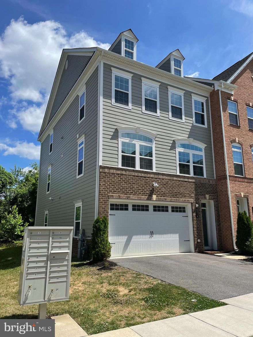 Gorgeous, end unit luxury townhome with 2 car garage and high-end finishes throughout, in amenity rich, Shipley's Grant! Travel inside to find a fantastic open layout with ample amounts of natural light, high ceilings, recessed lighting, gorgeous floors and so much more! Home features over 3090 Sqft of living space!! Bright living room with gleaming engineered hardwoods is open to kitchen and dining room. Living room offers access to maintenance free deck-perfect for relaxing or grilling!! Stunning gourmet kitchen boast white cabinetry, granite countertops, glass-tile backsplash, breakfast island, upgraded stainless steel appliances and spacious walk-in pantry. Separate dining room with sitting area provides plenty of space to host large dinner parties! Upper level offers spacious bedrooms with large closets & windows along with an stylish bath and laundry room. Luxurious master suite boasts a gigantic walk-in closet and a beautifully styled master bath with dual vanities, tile floor, and a huge tiled shower with double benches & dual roman shower heads. Lower level showcases a spacious family room with full bath that could be used for a guest suite, office, or more! Lower level provides access to a generous, flat yard and access to the 2-car garage. Additional driveway parking and plenty of unassigned parking overflow. Community offers miles of walking and biking trails, 2 pools, clubhouse with patio and outdoor fireplace, tot lot and so much more! Starbucks, great restaurants and retail are just a quick walk down the street. Less than 15 min from BWI Airport. Close to Rt. 29, 175, 100 and 95. Do not miss this amazing opportunity!