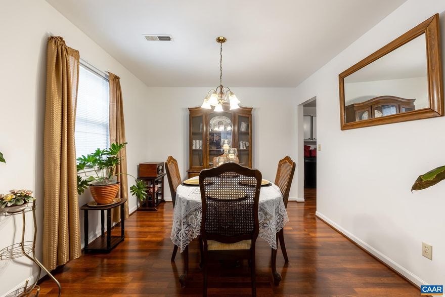 This charming 3-bedroom, 1.5-bathroom townhouse is perfectly located in the heart of the City of Charlottesville, offering both convenience and comfort. The home spans two stories totalling 1200 square feet, with a welcoming layout. You'll find beautiful wood laminate flooring throughout, providing a sleek, easy-to-maintain surface that flows seamlessly from room to room. The main level features a spacious living area, well-appointed kitchen with ample counter space and cabinetry, a cozy dining area, a half-bath, laundry closet, and utility room. Upstairs, you'll find 3 comfortable bedrooms, and a full bathroom. At the rear of the home, a lovely screened-in sunroom extends your living space, providing a serene spot to enjoy the outdoors, whether it's morning coffee or evening relaxation. The townhouse is just 3 minutes from shopping, making it incredibly convenient for daily errands and weekend outings. This townhouse blends urban living with comfortable, quiet spaces?ideal for anyone wanting to be close to everything Charlottesville has to offer.,Quartz Counter,White Cabinets,Wood Cabinets