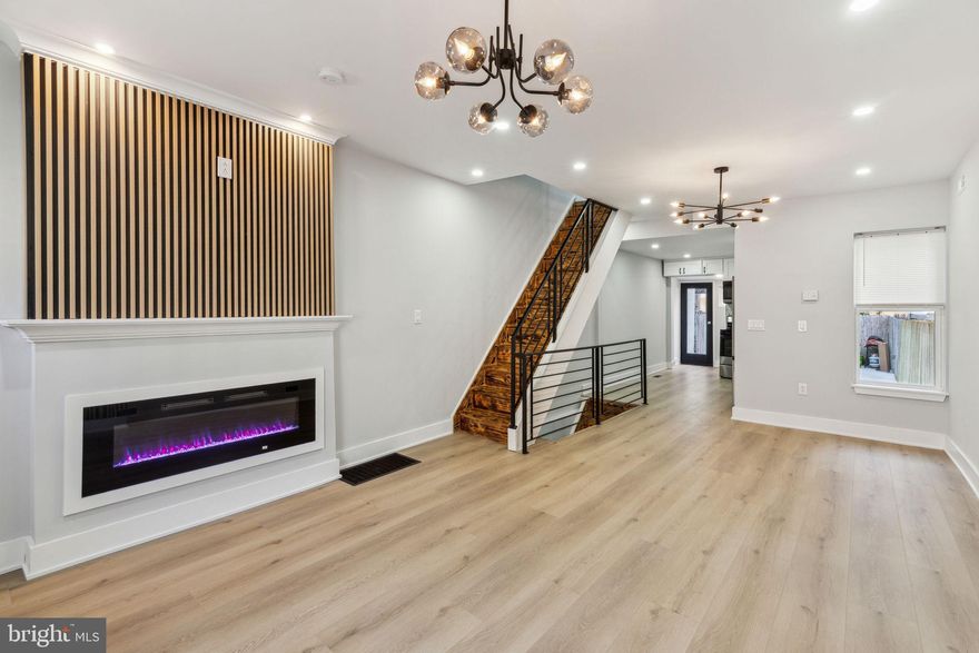 Nestled on a beautiful block in Port Richmond, this stunning 3 bed 2  bath newly renovated property offers an abundance of natural light. This home boasts beautiful vinyl floors throughout. The spacious living room provides the perfect place to relax or entertain with feature wall and built in fireplace. The large, modern kitchen is a chef’s dream, complete with quartz countertops, stainless steel appliances, and ample cabinet space, and a dedicated dining space. Upstairs, you'll find three generously sized bedrooms, along with a full bathroom featuring a tub and tiled surround. The fully finished basement, includes additional living space , a full bathroom with full shower, and a laundry area. Outside, the large 500sqft fenced-in yard provides privacy and space for outdoor enjoyment. Don’t miss out on this incredible opportunity to own a unique and spacious home in a prime location!