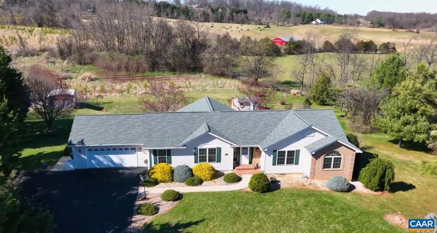 You can enjoy the best of both worlds that includes peaceful country living and the convenience of restaurants, shopping, hospitals, and I64. Located just 4 miles to 64, this spacious home is tucked away at the top of a cul-de-sac sited on 1.12 acres with pastorial views. The garden spaces are perfect for anyone that wants to live off the land. When you arrive, the level front yard has room to bring your rockers and enjoy the mountain views. The open concept main living areas feature hardwood floors, crown molding, vaulted ceiling in the great room open to the kitchen with solid surface countertops and stainless appliances. Walls of windows in the sunroom overlook the sprawling backyard and leads to the covered deck for outdoor enjoyment. The primary suite with ensuite bath include double bowl vanity, jetted corner tub and separate shower. Two additional bedrooms with full bath and a nice sized laundry room with washer dryer. Terrace level includes a spacious rec room, full kitchen, bonus room and full bath. Walk out oversized workshop with workbenches. Various fruit trees and bushes, BBQ Pit, Garden spaces, 3 sheds with power and a lean-to for all of your outdoor equipment and more. Whole House Generator Hookup.,Solid Surface Counter,Fireplace in Basement,Fireplace in Living Room