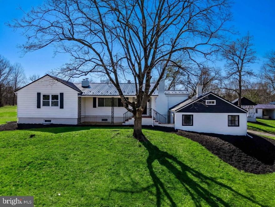 Set on 10.61 scenic, rolling acres in North Middleton Township, this beautifully renovated ranch home offers peaceful country living. Perched atop a hill, this home showcases a striking new black metal roof and a picturesque setting highlighted by sweeping valley views.  Inside, the brand-new kitchen is a true centerpiece, featuring Mennonite-built custom cabinetry, granite countertops with a metal backsplash, a double stainless farmhouse sink, and all-new stainless steel appliances. The open-concept layout flows into the dining area, where a woodstove insert with a fan system distributes warmth throughout the home.  The cozy living room showcases hardwood floors, custom built-ins, and a wood-burning fireplace, all complemented by large windows that frame the surrounding landscape. Hardwood flooring continues throughout the bedrooms, each offering ample closet space. Both bathrooms have been renovated, and new vinyl windows throughout enhance efficiency and comfort. A unique “smart door” off the kitchen provides adjustable privacy with switchable frosted or clear glass.  The partially finished basement expands your living space with a recreation room featuring a woodstove, along with a potential fourth bedroom or home office. Outdoor amenities are equally impressive, including a smaller two-stall barn with a new roof and a pavilion outfitted with a new metal roof, ceiling, and outdoor fans—ideal for outdoor picnics and entertainment. Wildlife, including deer and turkeys, are frequent visitors, adding to the property’s charm.  Additional highlights include a new 200-amp electrical service, recently pumped septic system, and enrollment in the Clean & Green Program with affordable annual property taxes under $3,000.  Turnkey homes on 10+ acres are a rare find—don’t miss this opportunity!