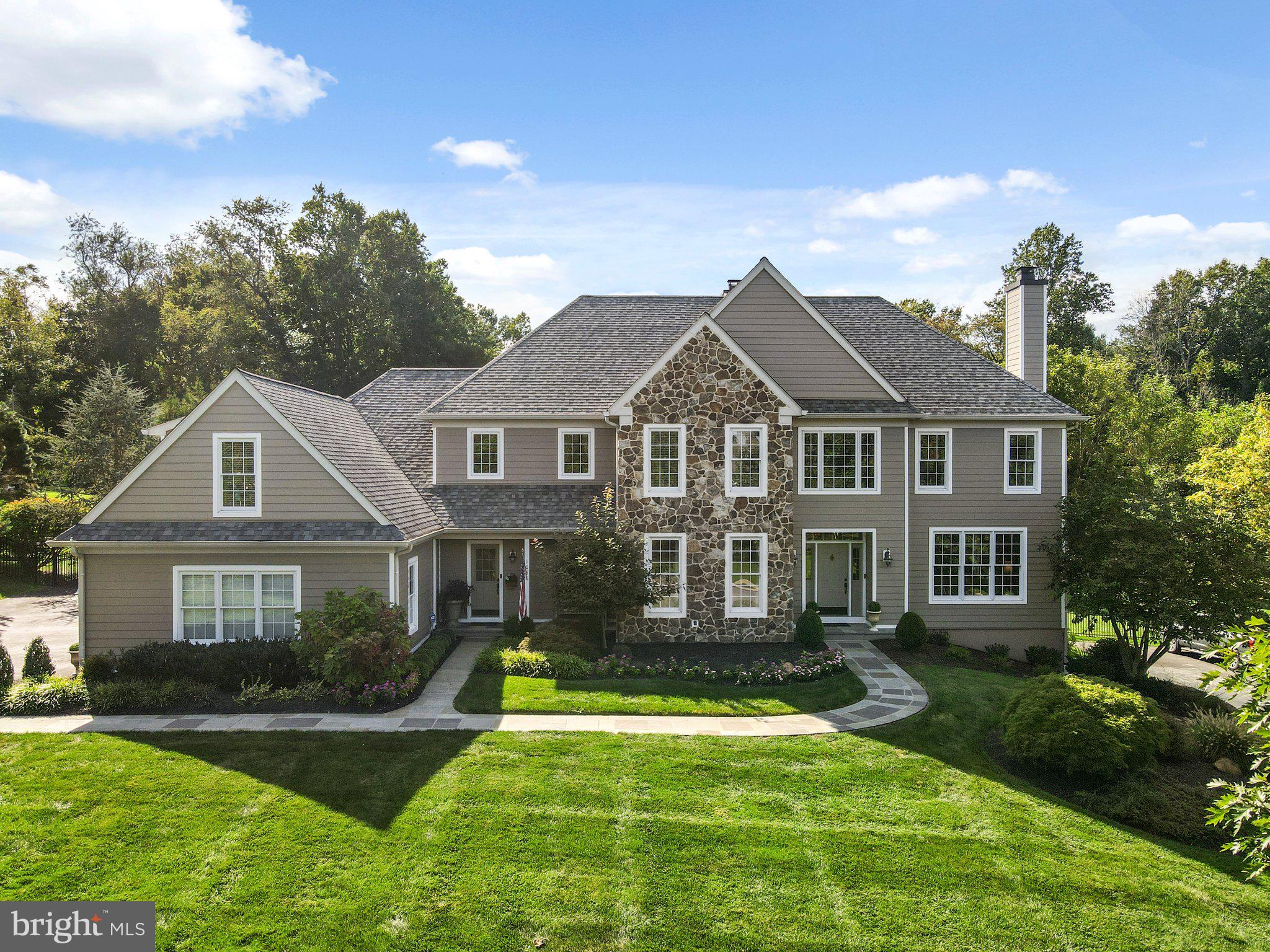 This is an entertaining dream home!! This 5 bedrooms, 3 full baths and 2 half baths with a gorgeous heated POOL, backs to the woods, all with new Stone & James Hardiplank! Enjoy the rear Oasis, from the stunning Pool to the flagstone rear patio & firepit, all with a beautifully landscaped front & rear yard. Enter the foyer with open floor plan, front to back open Foyer, custom moldings thru out. Don’t miss the 1st & 2nd floor newer hardwood flooring. To the right of the foyer is the living room with upgraded lighting, custom moldings and a gas fireplace surrounded with Stone. Double French doors lead to a private home office and views of the rear yard! To the left is the dining room, featuring wainscoting and custom crown molding. The family room has a cathedral ceiling, palladium windows, gas fireplace surrounded with Stone, custom built-ins & a French doors that leads to the Patio. Family Room is open to into the custom kitchen, with an island, stainless steel appliances including a five-burner stove, double oven with warming drawer, farm sink and a large walk-in pantry. Two powder rooms, a mudroom, and breakfast room with plenty of windows for natural light that opens to the rear Oasis. Enjoy the rear Flagstone Patio, firepit, access to driveway & Heated Pool with newer automatic cover. The 2nd floor features, the master bedroom suite provides a privacy, including a sitting room with palladium window, his-and-her custom-fitted walk-in closets, and luxurious bath with double vanity, soaking tub, walk-in shower. Three additional bedrooms, two additional baths, an updated laundry room, a bonus room/fifth bedroom with additional storage/ could be 4th bathroom, and back staircase that leads to the kitchen complete this level. The large finished lower level with walk-out, gym room & tons of storage. This home has it had MANY updates, please see attached list, carriage style garage doors, 3 zone HVAC system & irrigation system. Minutes to Malvern , East Goshen Park & downtown WC, located in the West Chester School District and close to many private schools. Easy access to Route 30, Route 202, the Pennsylvania Turnpike, and just minutes from regional rail lines. Stunning home!!