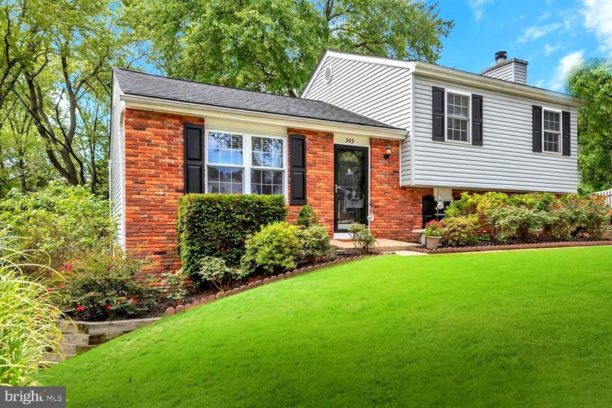 REMARKABLE REJUVENATED  with CAREFULLY CURATED UPDATES at every glance!  Pride of ownership curb appeal with meticulously manicured landscaping and low-maintenance brick & siding exterior.  Tiered rear lounging and entertaining oasis with raised DINING DECK, GRILLING PATIO, & YARD!  NOTEWORTHY: Glossy hardwood & tile floors, decorator neutral paint palette/carpeting, classic trim/wainscoting, skilled built-ins, and updated lighting.  Light-filled open concept main level linking picture window Living Room, Dining Room spilling out to deck, and dine-in stainless appliances in Kitchen.  Upper level Palladian window Primary Bedroom Suite w/dual entry Bath and 2 additional BRs sharing Full BA.  ALL Baths stylishly renovated!  Lower level incl. walkout Family Room w/brick hearth fireplace, sunken Bedroom, Half Bath/Laundry, and mega storage options.  Multi-vehicle driveway parking.  Mere minutes from shopping centers/malls, eclectic dining, Magothy River & Bay boating, AA Community College, Annapolis City Dock/USNA, Bay Bridge, & commuter RTs 2/50/97. Entrance to this street is for the Broadneck Peninsula Trail which leads to the  B&A Trail & Sandy Point State Park! Also be sure to check out the 6 acre public community park at the end of the street!  A WONDERFULLY WINSOME & WELCOMING HOME!