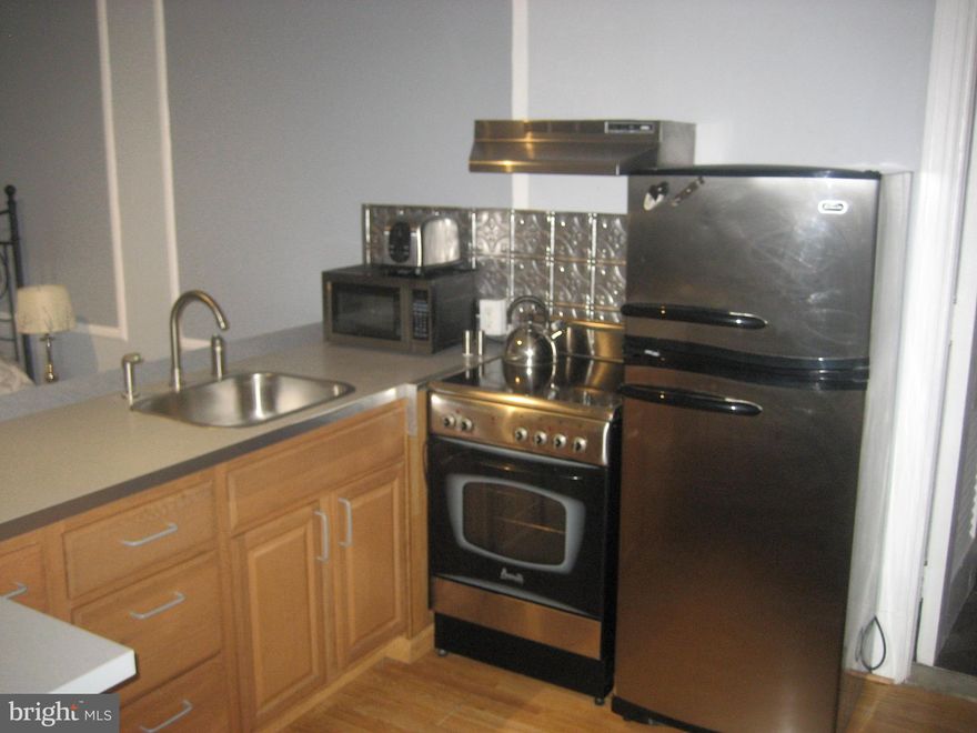 Available now. COMPLETELY FURNISHED, ALL UTILITIES ARE INCLUDED in your rent, except for in-unit Internet! There is free wi-fi in the lobby of the building. You get water, electricity, heat, and cable TV (Channels 1-100 + HBO) FOR FREE. Unit #1414 is one of the nicest studio condos in the building, RATED BY MANAGEMENT AS ONE OF THE TOP 4 STUDIOS IN THE BUILDING, with an L-shaped kitchen with breakfast bar, microwave, modern Shaker style cabinets, a full-size stainless steel refrigerator and stove, hardwood floors, and lots of bright natural light! Not to mention your utilities are included in rent! All furniture is included with lease: couch, bar stools, bed. Higher floor with view of the Kimmel Center. The Arts Condominium building has an ideal Center City location, walkable to City Hall, Washington Square West, Midtown and Rittenhouse Square areas. SEPTA's Broad Street subway line at Broad/Walnut is at the end of the block; PATCO station is right across the street from the building. The building features a 24/7 front desk attendant, fitness center, business/club room, laundry facilities, on-site management/maintenance and computer terminals with free wi-fi in the lobby. About the neighborhood: Centrally located just off Broad Street, and walkable to a long list of convenient and fun neighborhood favorites. The iconic Avenue of the Arts is home to big names like the Kimmel Center, Academy of Music, Wilma Theater, University of the Arts, Suzanne Roberts Theatre, amazing eateries like City Diner, Sumo Sushi, Big Gay Ice Cream, Giorgio on Pine, Volver, and hotspots such as Woody's, Fox & Hound, Howl at the Moon, and MUCH more! Lease Terms: Generally, first month, and one month security deposit due at, or prior to, lease signing. Other terms may be required by landlord. $45 application fee per applicant.  $250 move-in fee. All utilities are included in rent, tenants responsible for in-unit Internet. The fee to use the bike storage room is $50.00 and tenants are provided with a key to the room. There are bike racks in the room and it is totally up to the tenant whether they wish to secure their bike with a lock. The room itself is locked and only available to other residents with keys to the room. Residents using the bike room need to know that bikes can only be transported through the side entrance and the their bike must be carried through the lobby, down the steps and into the bike room. It is permissible to keep your bike in your condominium. This special unit comes ready to move in.