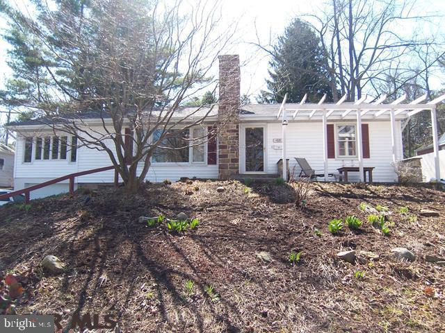 Charm, serenity and efficiently-configured living space in a well-maintained 1949 ranch in West College Heights with elements of bungalow and Arts and Crafts styles. Close to campus, downtown State College, bike trails and Radio Park Elementary School. Wonderful views of professionally landscaped front and back gardens. Features include five built-in bookcases and a skylight in the main floor study; upgraded electric; gas line for the kitchen range and living room fireplace; new roof, repointed chimney; laundry on the main floor; upper-level patio with arbor; lower-level stone patio with custom-built wooden staircase, facilitating access; fully remodeled lower-level suite with large bedroom, family room and separate bath. Plumbing connections in place for a third bathroom in the study. Ample room for expansion back into private backyard.