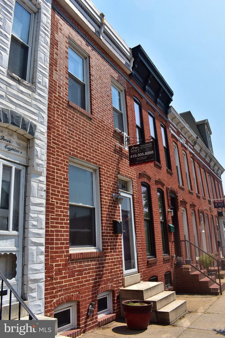 Metropolitan Dream 2BR 2BA:  It's city Living at its finest. This 2 Bedroom, 2 Bath Brick-Front Townhome is located in the heart of Federal Hill! Featuring beautiful hardwood Flooring Throughout, Main Level Living Room w/ Exposed Brick & Formal Dining Room. You'll love the gourmet Kitchen w/ SS Appliances, granite Counter tops & tile back splash!The master Bedroom has an attached Full bath that's been recently updated.1-Car Parking Pad, Rooftop Deck w/ Harbor Amazing Views. This one will go fast, Don't Miss It!