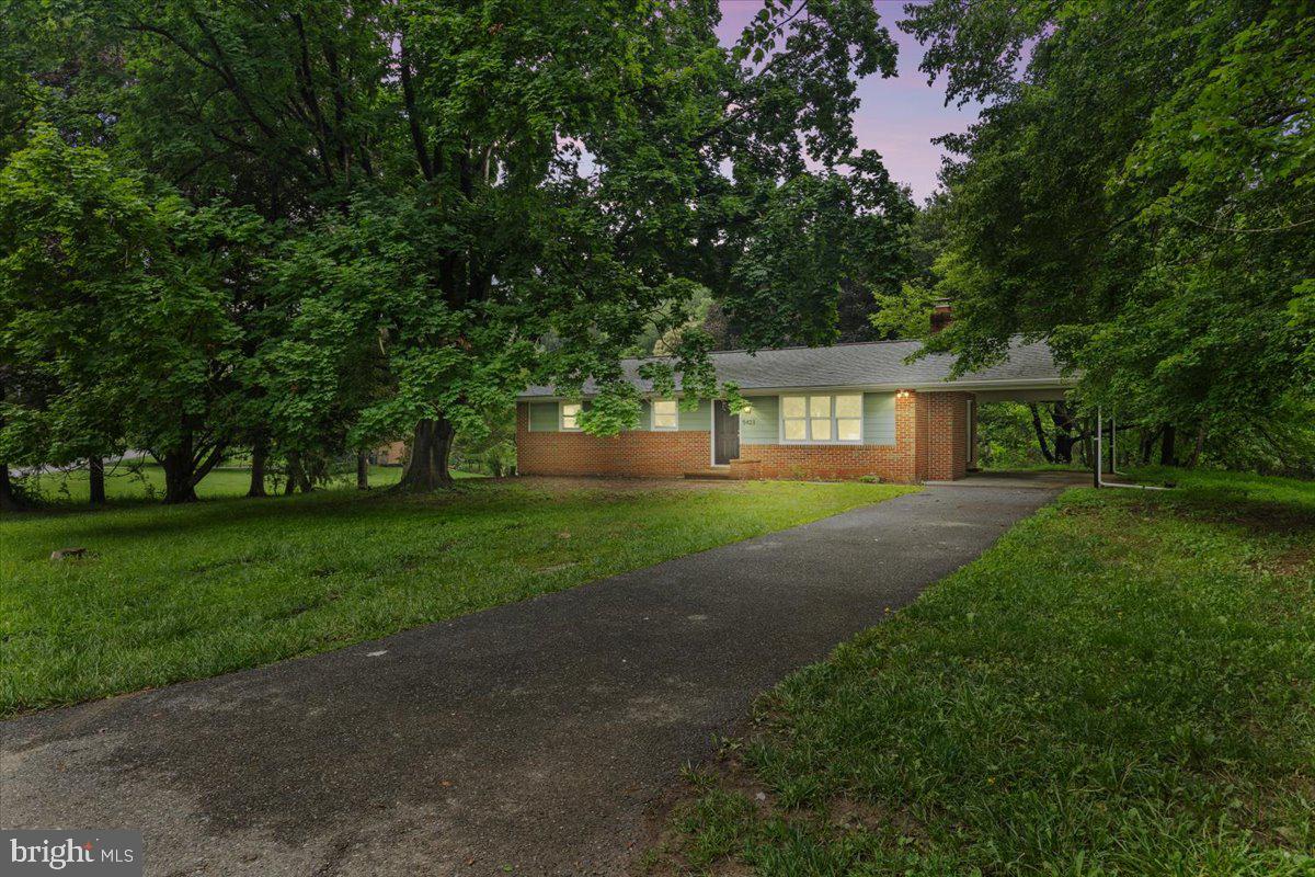 Welcome to this beautifully renovated brick rancher featuring an attached carport and stylish updates throughout. The main level boasts crown molding, recessed lighting, a spacious living room, dining area, and an updated kitchen complete with stainless steel appliances and a breakfast bar. You'll find three comfortable bedrooms and a full bath on the main level. The finished lower level offers a versatile space with a wet bar and full bath, ideal for a home office, study, or potential fourth bedroom. Step out onto the rear deck overlooking the backyard, perfect for relaxing or entertaining.