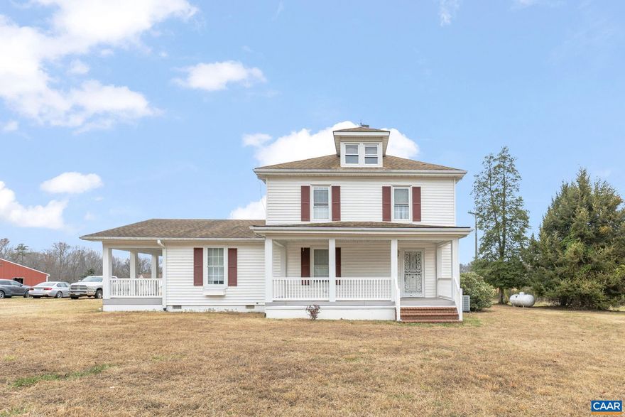 Opportunities like this don't come along often! Well maintained 1920s farmhouse on 70 bucolic arces, comprised of two separate parcels. Approximately 40 acres cleared and in fields, most of which is fenced according to the owner, The remaining 30 acres is comprised of towering mixed hardwoods.  Approximately 1100 feet of road frontage, with a stream following the rear property line. The 1700sf barn has endless possibilities, currently sectioned off into equipment storage and 2 stalls to the rear, adjoining the paddock.  The house radiates curb appeal, with two massive porches on the front and side, and a spacious deck to the rear.  All of which have composite decking and vinyl rails.  Low maintenance vinyl siding, replacement vinyl windows, and an architectural shingle roof, will allow you to spend your time tending your horses, hunting, or tending the farm.  Inside you"ll find impressive period detail, ornate trim work, granite counter in the kitchen, a remodeled primary bath, all within generously sized rooms.  Situated just 5 minutes from Zion Crossroads and I-64, with easy access to both Charlottesville and Richmond, this location balances rural tranquility with urban accessibility.  Don't miss this amazing opportunity!!,Fireplace in Dining Room