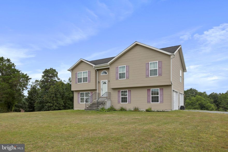 This single-family home located on 1.59 acres has beautiful mountain views! This 3 bedroom, 2 bath split-foyer has an open layout in the main living area, great for entertaining! Kitchen features an island for extra prep and eating space and a view to the backyard. The spacious hall bath has double sinks, and the primary suite has two closets and a private bathroom. The unfinished basement offers plenty of options for flexible living space! Nice sized two car garage for parking or extra storage. Pets on a case-by-case basis. Available Jan 1, 2024.