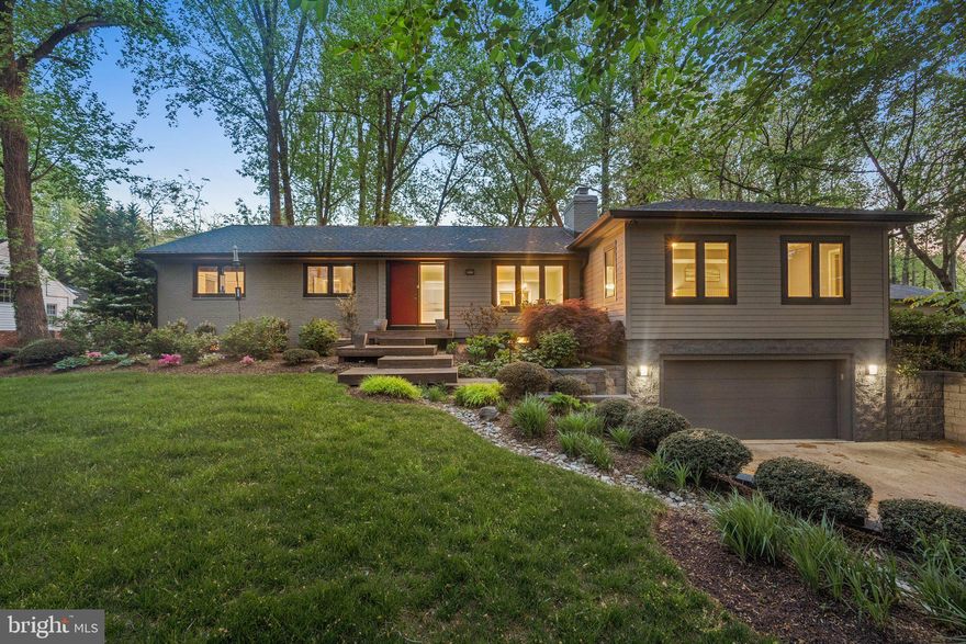 Welcome to 7903 Old Falls Road, situated on a private half-acre in McLean. This meticulously maintained ranch-style residence, built in 1961 and thoughtfully expanded in 2008, offers approximately 3,800 square feet of living space on two levels.

Step inside to freshly painted interiors with hardwood floors and abundant natural light. The spacious living and dining areas, warmed by one of three fireplaces, provide an inviting atmosphere perfect for entertaining. Enjoy the ease of single-level living with four generously sized bedrooms on the main floor. The expansive primary suite offers a walk-in closet, large en-suite bath with dual vanities, and privacy away from the rest of the home. The original side of the home has a second bedroom with an en-suite, and bedrooms 3+4 share a third full bath.

The versatile lower level includes a spacious recreation room with a fireplace, ideal for entertainment or relaxation, along with a fifth bedroom and full bath—perfect as a guest or in-law suite. A dedicated gym could certainly be used as a 6th bedroom with the walk-up stairs as a private exit. There’s ample storage and a laundry room on this level as well.

Outdoors, a large deck overlooks the fully fenced backyard, providing a peaceful, park-like setting surrounded by mature landscaping. Additional amenities include an oversized two-car garage and plenty of driveway parking.

Conveniently located near Tysons Corner’s upscale shopping, dining, and entertainment, this home offers quick access to major routes including I-495, Route 7, the Dulles Toll Road, and the Silver Line Metro.