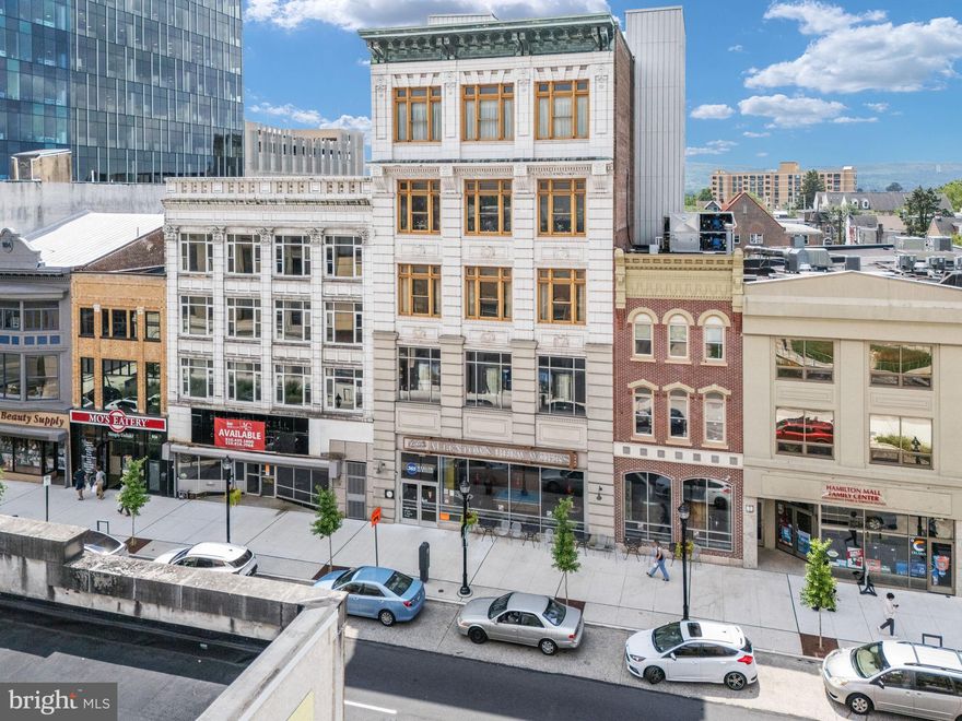 Fegley’s Brew Works Building – an iconic, income-producing commercial asset located in the heart of Downtown Allentown. This five-story, ±51,816 square foot mixed-use building is ideally situated in the Neighborhood Improvement Zone (NIZ), offering rare access to significant development incentives and one of the city’s most vibrant and high-traffic corridors. Fully renovated in 2009 and meticulously maintained, the building features a dynamic blend of hospitality, entertainment, and office space. The lower level, ground floor, and multiple upper levels are outfitted for events and hospitality, including a commercial kitchen and support spaces across several floors. The third and fifth floors offer large, open layouts with high ceilings, ideal for event use or easily convertible into creative office space. The fourth floor is currently leased to two office tenants and showcases a stylish design with exposed brick and glass walls, generating immediate rental income. Two additional floors are used as owner-occupied office and production space, offering flexibility for future repositioning. On-site brewing infrastructure remains in place, available for sale for continued use or repurposing. Whether you’re an investor seeking income and upside, or an owner-operator looking for a flagship location, this high-profile property offers unmatched visibility, walkability, and potential—just steps from the PPL Center, Da Vinci Science Center, and Archer Music Hall.
