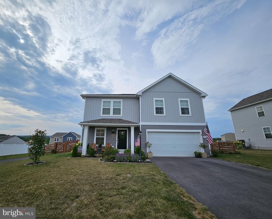 No detail has been overlooked in this swoon-worthy single-family home in Morning Dove Estates! Built in 2020, it's like new - and anything but builder-grade. It boasts luxury vinyl plank flooring throughout both levels and ceramic tile in the bathrooms and laundry room. With an oversized island, quartz counters, and soft-close cabinets, the kitchen radiates luxury - and the adjoining, over-sized butler's pantry provides plenty of practical storage. The family room exudes warmth with wood beams, shiplap, and an electric fireplace. The dining room features elegant wainscoting and could easily be converted into a play room or office. Upstairs, the primary bedroom does not disappoint with a wood-paneled accent wall, electric fireplace, upgraded en-suite, and a large walk-in closet. As you explore the rest of the upper level, you'll find that two bedrooms include sliding barn doors. The spacious laundry room has a barn door, too! If you aren't already in love, take a moment to soak in the pastoral views from the fully-fenced backyard. This gem will not last long! Schedule your tour today.