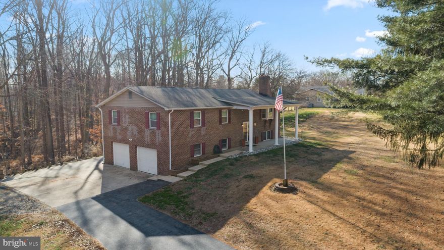 Welcome home to space, privacy, and freedom on 6+ beautiful acres in Dunkirk with no HOA. Set well off the road with generous distance between neighboring homes, this property offers a truly private, peaceful feel rarely found at this price point. The well-maintained two-level split foyer features brand new LVP flooring throughout the foyer and main level, fresh interior paint, and a bright, inviting layout ideal for both everyday living and entertaining.

The spacious living room is highlighted by a masonry fireplace, while the gourmet kitchen serves as the heart of the home with granite countertops, stainless steel appliances, warm wood cabinetry, and a large island perfect for hosting and gathering. A formal dining room opens to the back porch, creating seamless indoor-outdoor flow for entertaining or quiet evenings overlooking the acreage.

The upper level offers three light-filled bedrooms and two full bathrooms, finished in a fresh, neutral palette ready for your personal touch. The fully finished walkout lower level expands your living space with soft carpeting, a cozy second fireplace, a full bath, and a dedicated laundry room—ideal for a recreation room, home office, or guest retreat.

Outdoors is where this property truly shines, with over six acres of open space, a back porch, ground-level patio, firepit area, and three storage sheds for tools, equipment, or hobbies. An oversized 29x24 side-entry garage and ample parking provide exceptional functionality. This is a rare opportunity to enjoy acreage, privacy, and flexibility—a home where you can slow down, spread out, and truly enjoy the space around you.