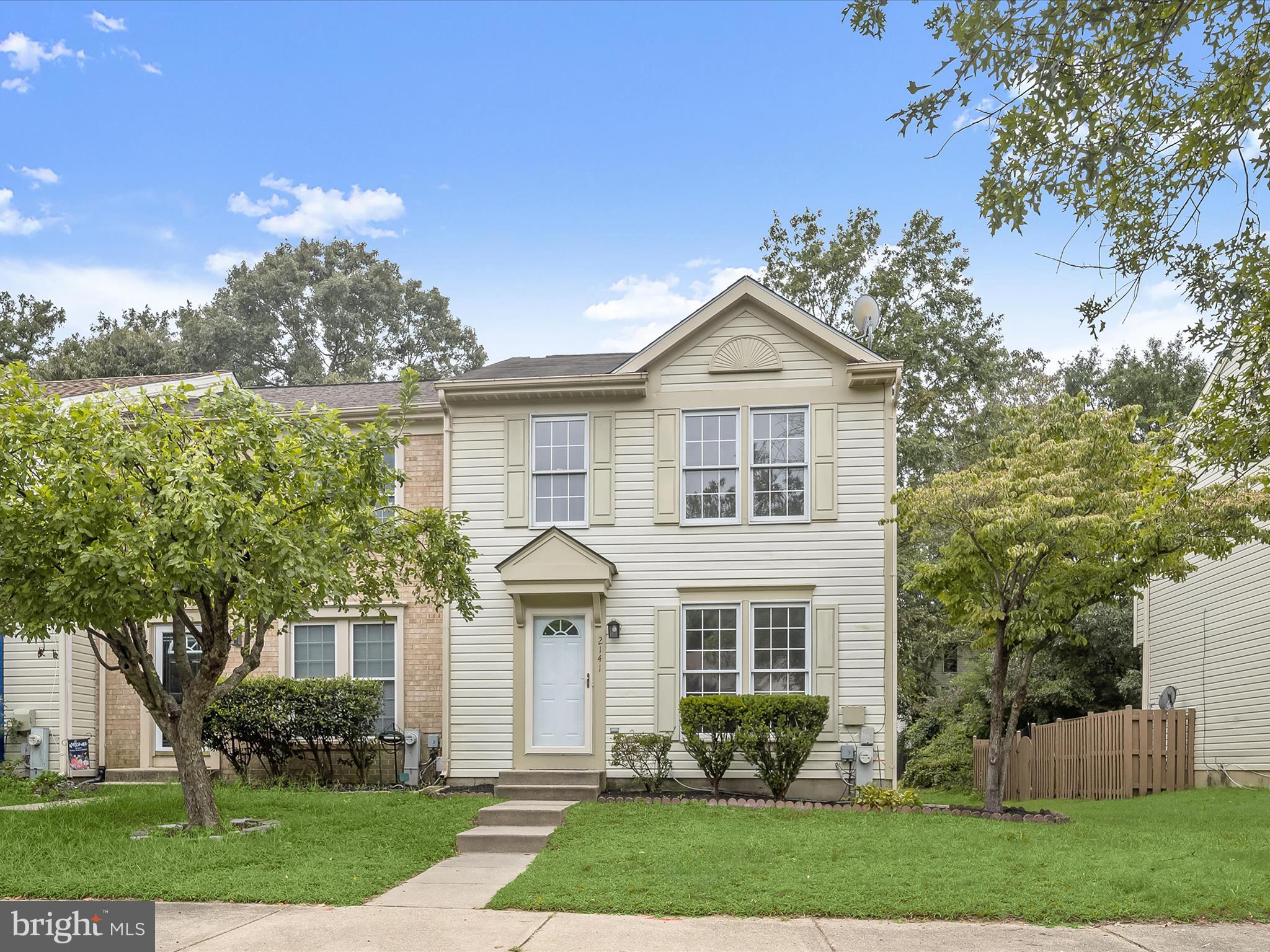 This beautifully renovated three-level end-unit townhome in the sought-after Seven Oaks community blends modern style with everyday comfort. Inside, wide plank laminate flooring and a neutral color palette create a fresh, inviting atmosphere. The spacious living room welcomes you upon entry and flows naturally into the kitchen and dining room combination. The kitchen shines with new shaker cabinetry, upgraded counters, stainless steel appliances, and two convenient pantries. Adjacent to the kitchen, the dining area is brightened by a sliding glass door that opens to the rear deck, the perfect spot for outdoor dining while overlooking the backyard and community green space. Upstairs, the expansive primary bedroom features multiple windows, a double closet, and an attached bath complete with a stall shower and stylish finishes. Two additional bedrooms and a full bath complete the upper level, offering comfort and versatility for family, guests, or a home office. The lower level provides additional living space with a cozy family room accented by recessed lighting and a convenient half bath. A utility room with laundry completes the level, ensuring function meets convenience. Beyond the home, Seven Oaks delivers an unmatched lifestyle. Residents enjoy access to community centers with fitness facilities, swimming pools, tennis and pickleball courts, and basketball or volleyball courts. Additional amenities include lighted tennis courts, picnic areas, well-maintained walking trails, and a community nature reserve that enhances the neighborhood’s scenic charm. Convenient commuter routes including I-97, I-95, and MD-100 place Baltimore, Columbia, BWI Airport, and Fort Meade all within easy reach. For shopping, dining, and entertainment, nearby Piney Orchard Marketplace and Arundel Mills provide endless options. Outdoor enthusiasts will love the proximity to Piney Orchard Nature Preserve and GORC Park, both offering scenic trails and recreational activities. This end-unit townhome presents a rare opportunity to enjoy a fully renovated interior paired with the extensive amenities of the Seven Oaks community and an unbeatable location. Please note: photos depicting furniture have utilized virtual staging.